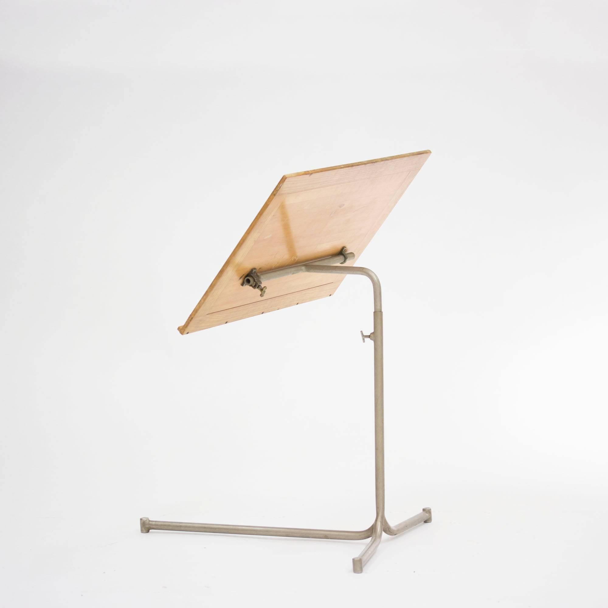 Birch and lacquered steel reading stand by Bruno Mathsson, created to accompany Mathsson's bentwood chaise lounges. The model has been used as a versatile side table in homes as well as in office spaces. This very early piece is from 1941 and
