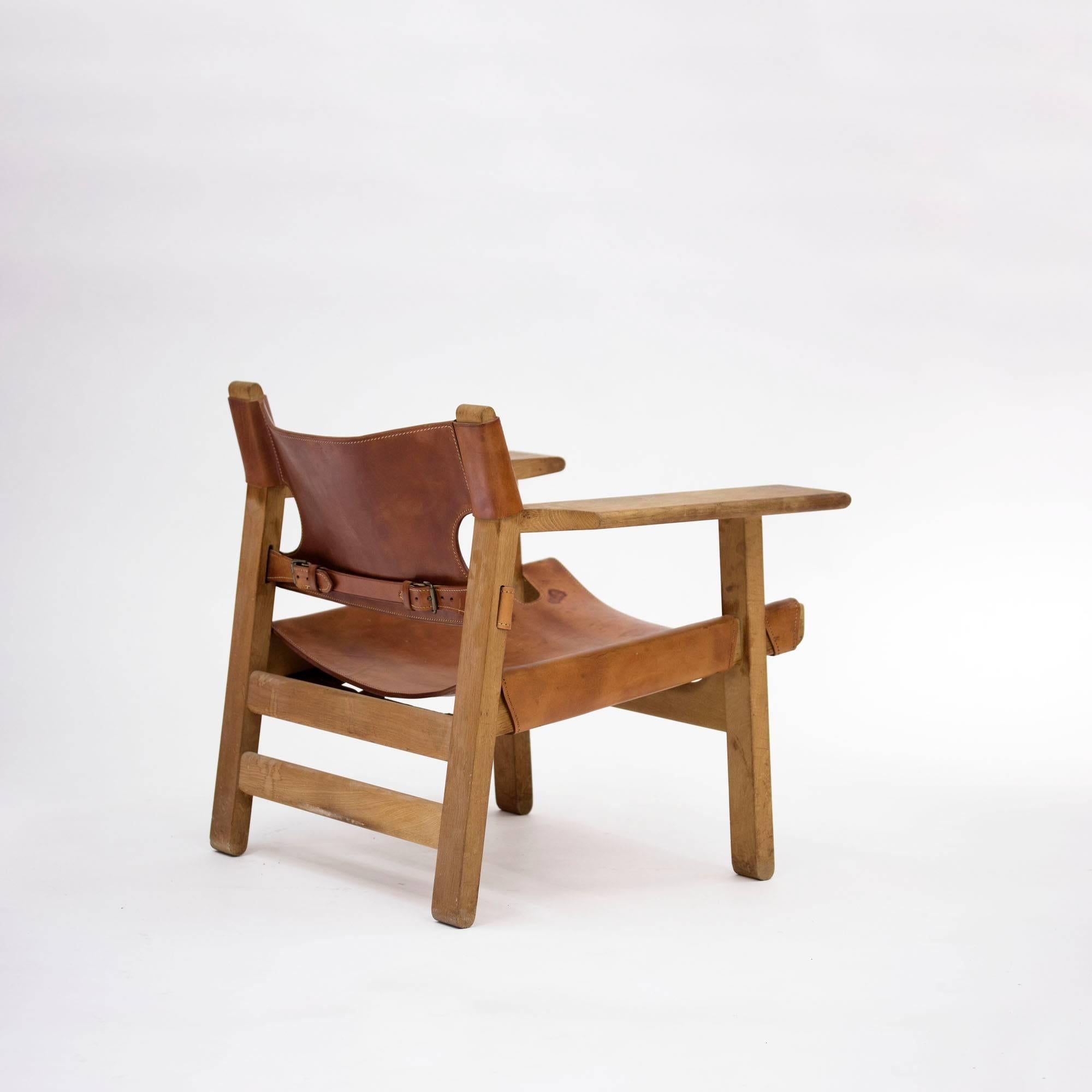 Imposing, iconic oak and cognac leather "Spanish Chair" lounge chair by Børge Mogensen. Mogensen got his inspiration for this design from a trip to Spain in 1958, where he came across a type of traditional chair which he then interpreted