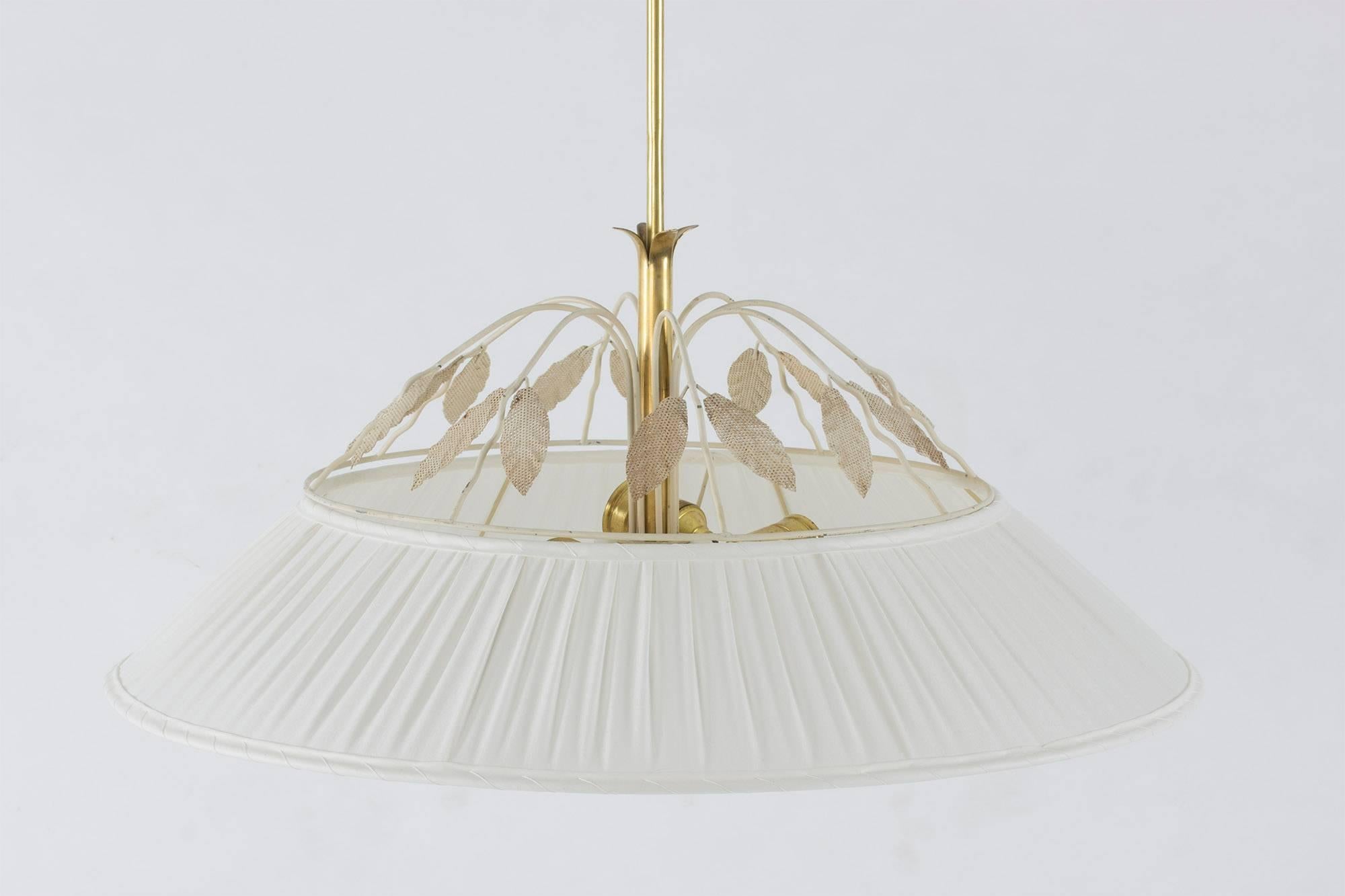 Exquisite ceiling lamp by Hans Bergström with a brass pole and cup and a lacquered metal frame dressed with white silk. The light source is shielded by a convex opaline glass disk in the bottom of the lamp and the top is crowned by a decor of metal