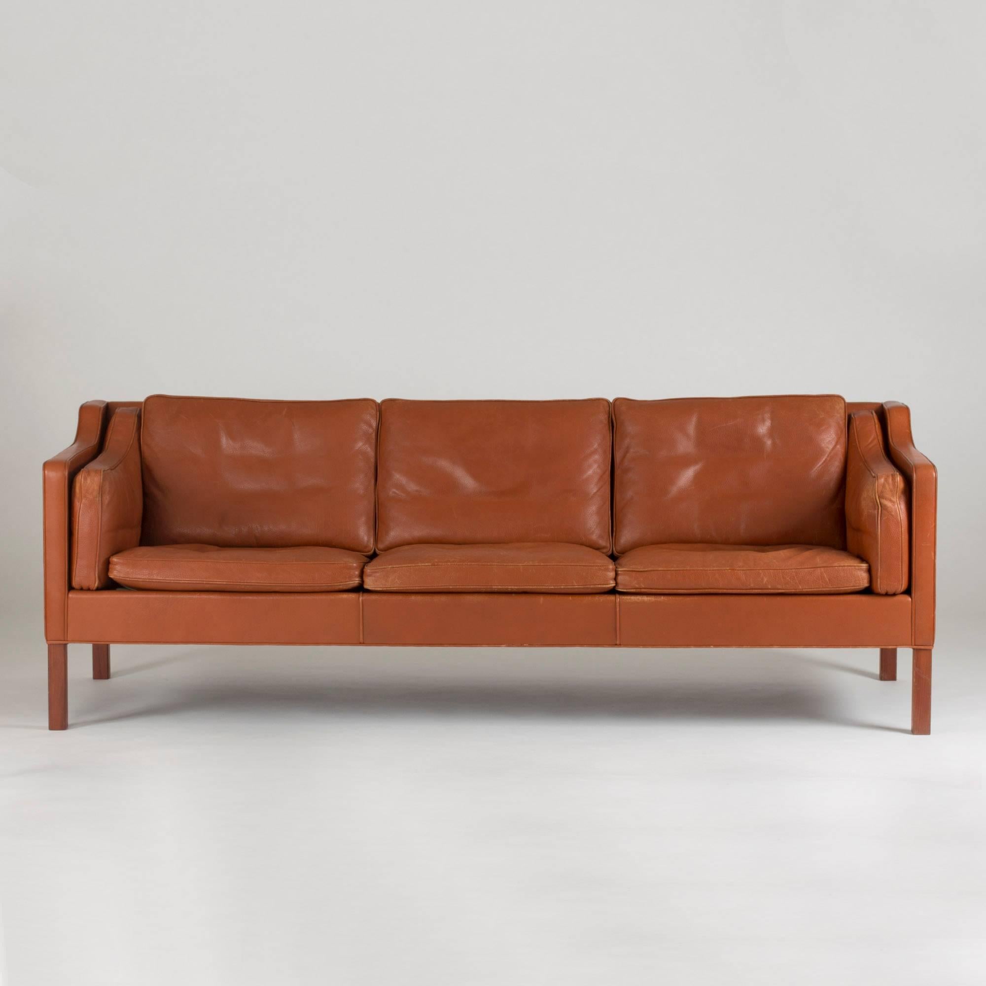 Timeless, comfortable and forever classy sofa by Børge Mogensen in rusty brown leather. Inner cushions at the armrests for added comfort.