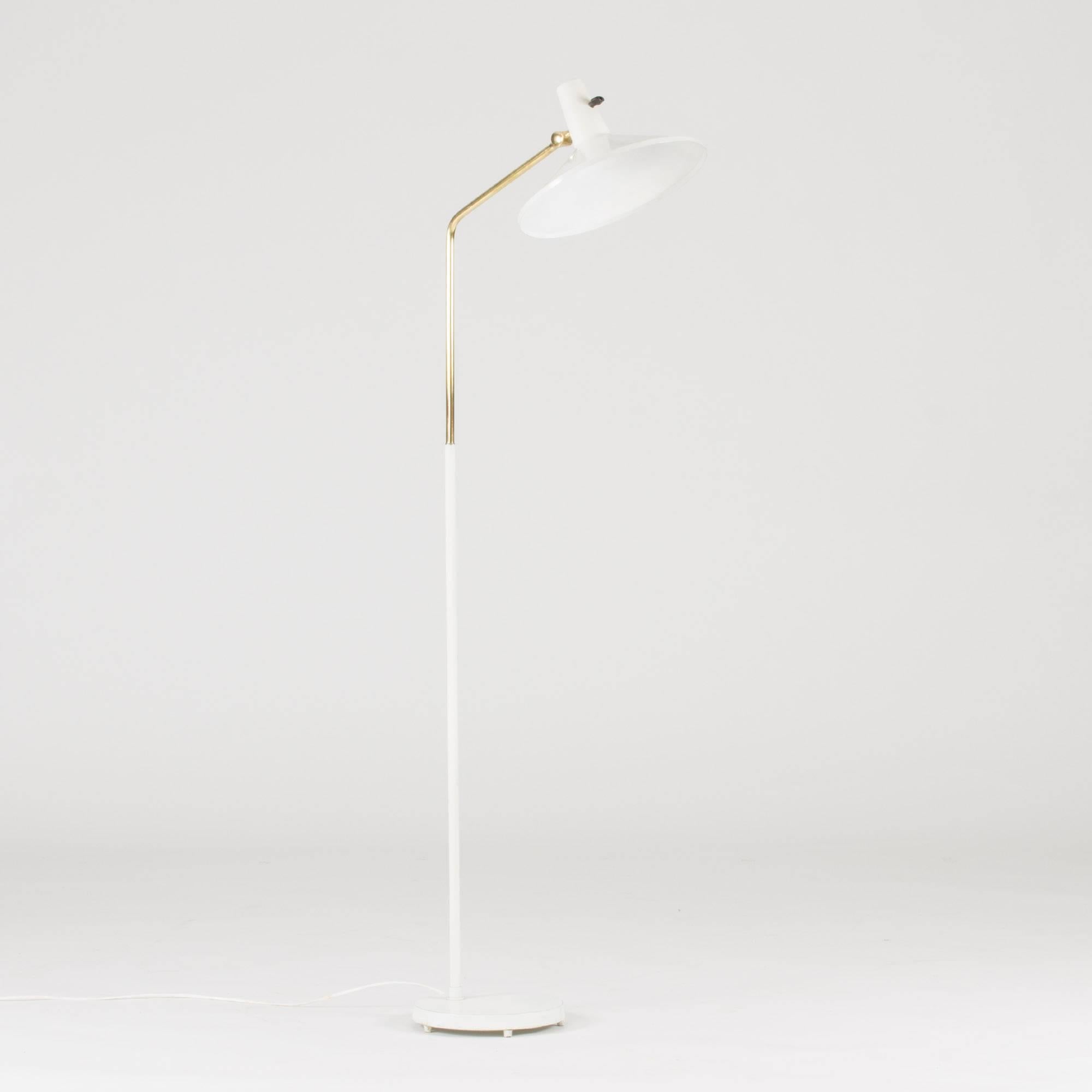 White lacquered metal and brass floor lamp with an edgy Silhouette by Bertil Brisborg, designed for the lighting department at NK department store.