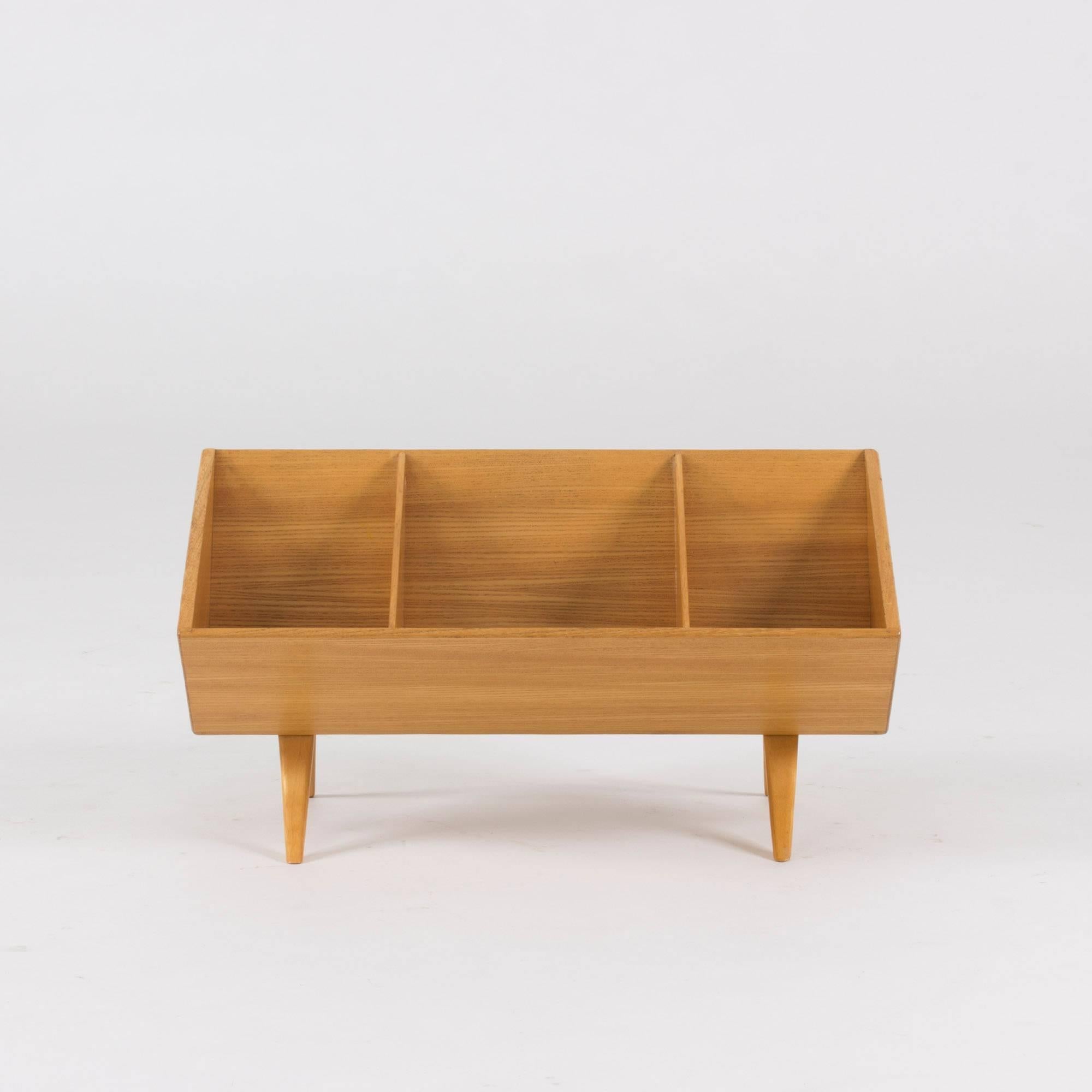 Wonderful table book stand perfect for pocket books or smaller objects by Bruno Mathsson. Light elmwood quality.