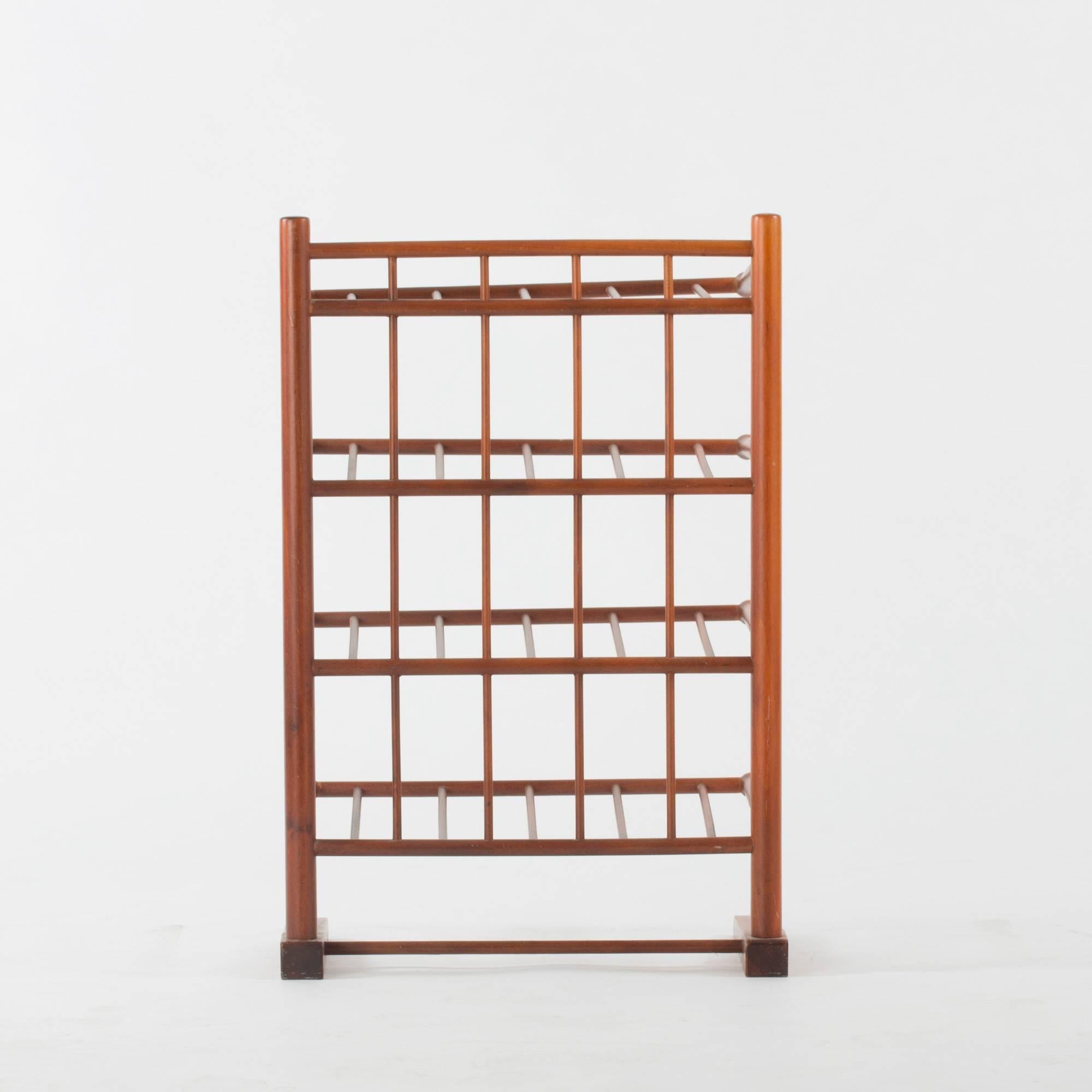 Elegant, airy mahogany book or magazine Stand, in all likelihood designed by Josef Frank for Svenskt Tenn. Can be placed on the floor or on a desk.