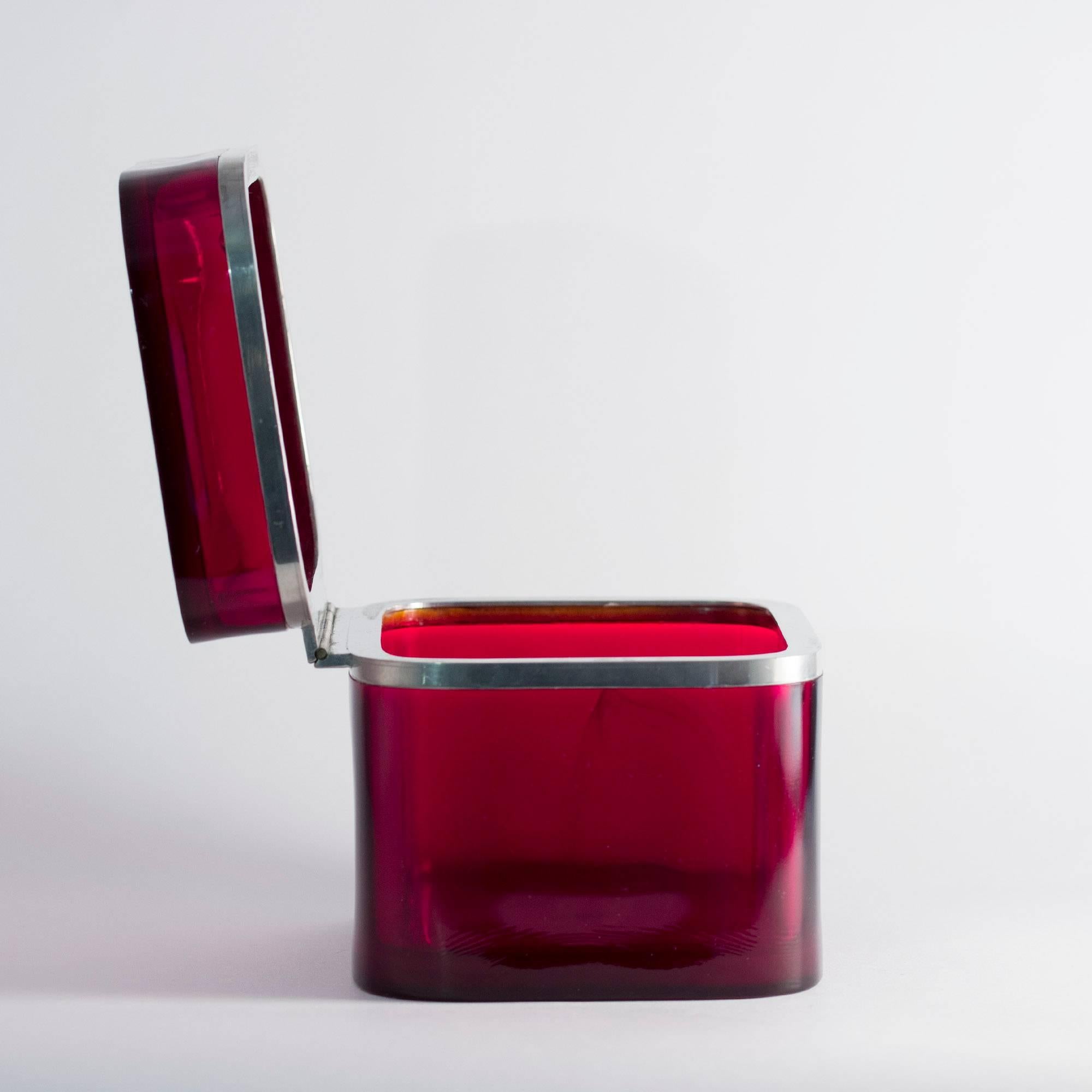 Amazing box in heavy, deep red glass quality by Josef Frank. The lid is mounted in a smooth pewter frame and the hinge is made from brass.