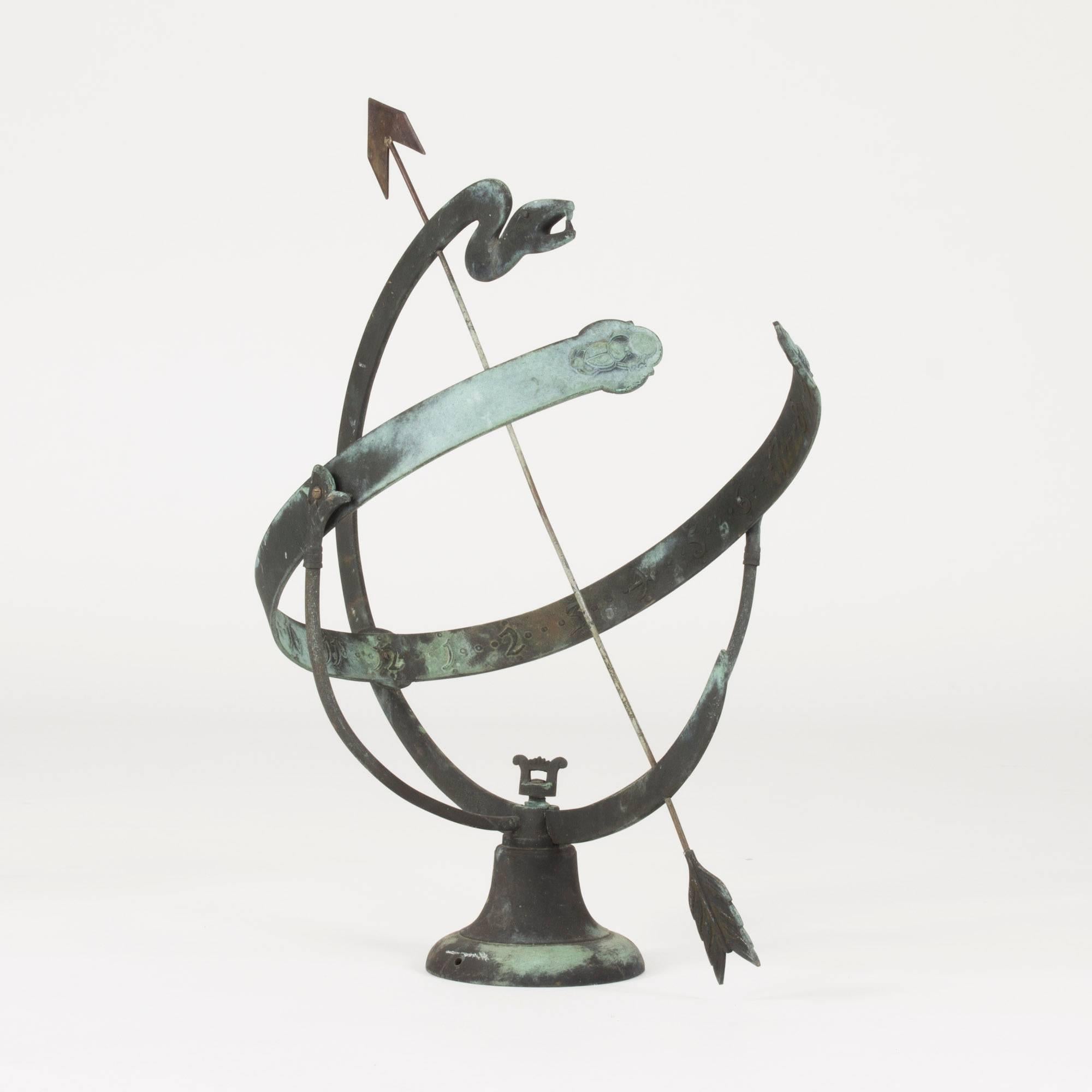 Gorgeous Swedish, 1920s sundial in bronze. A stylized serpent as frame and the entire piece full of incredible details such as the Egyptian scarab beetles etched into the number-arms. This top-quality bronze beauty represents Neoclassicism at its