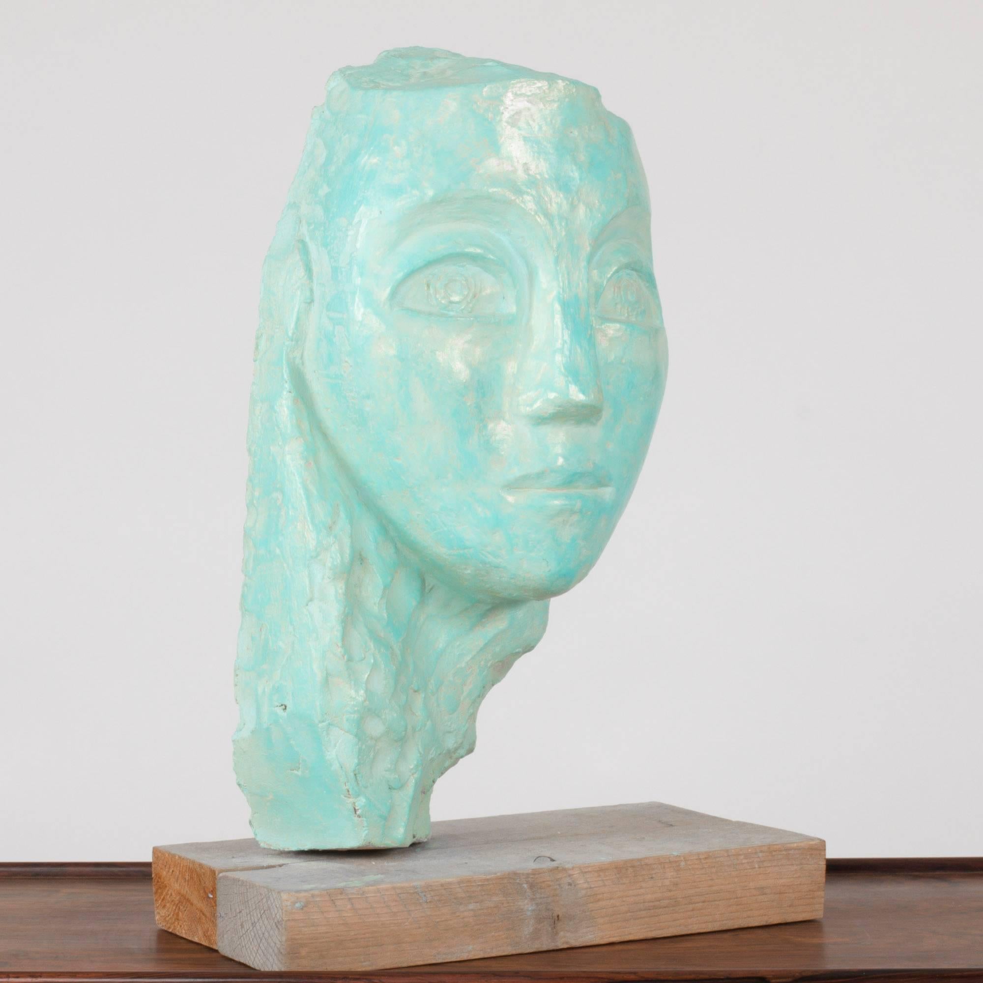 Soulful earthenware sculpture of a face by Lennart Olausson. Glazed turquoise with a slight shimmer.

Lennart Olausson (born 1944) is a Swedish artist, educated at Konstfack 1961-1965 and Kungliga Konsthögskolan (Royal Swedish Art Academy)