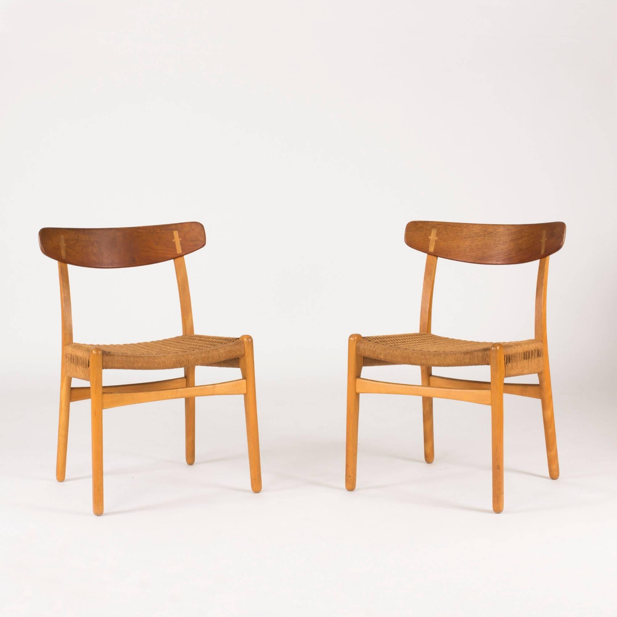 Set of wonderful “CH 23” dining chairs by Hans J. Wegner. Oak bases and teak back rests, paper cord seats.