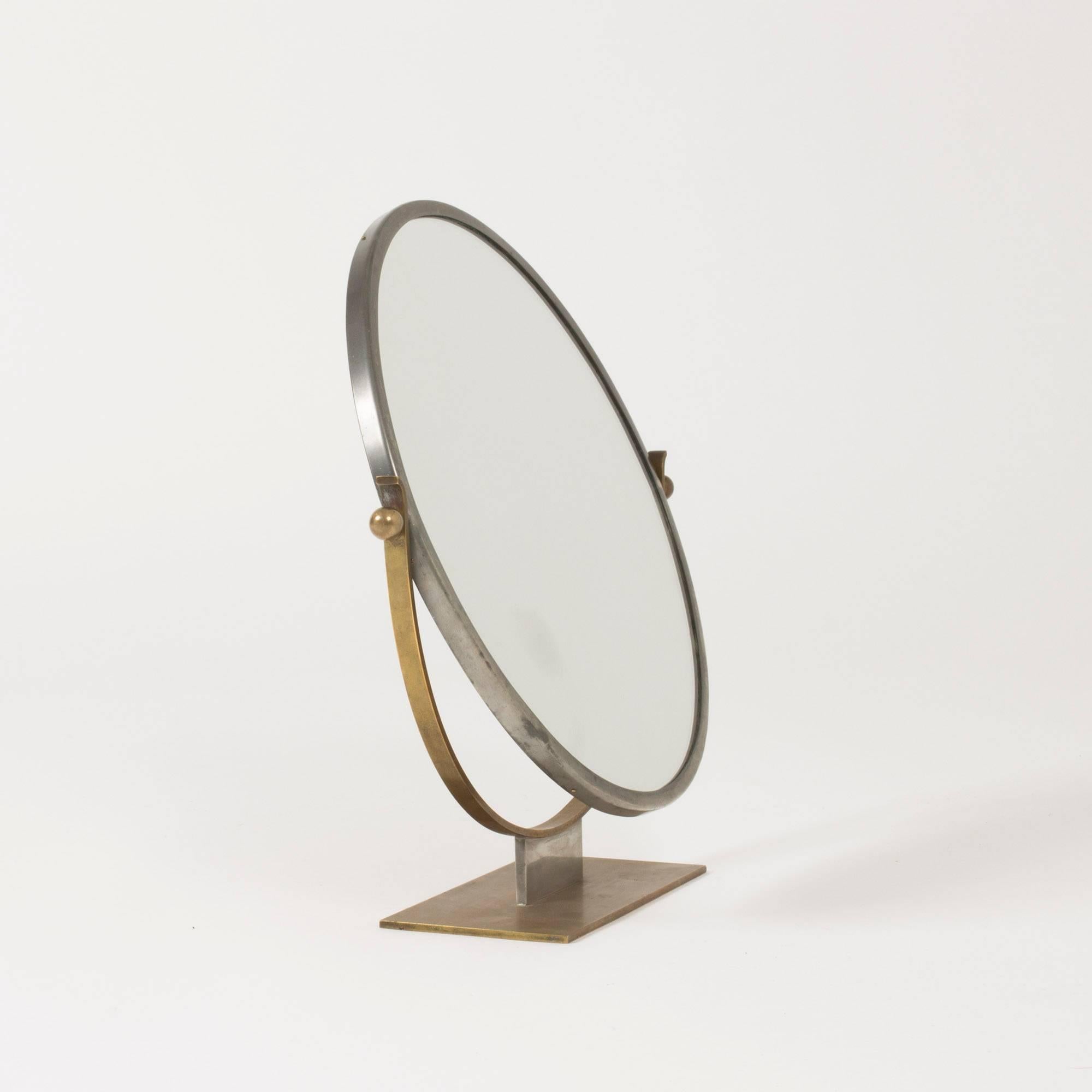 Functionalist table mirror by Ivar Ålenius-Björk, with strict lines and a beautiful combination of brass and pewter.