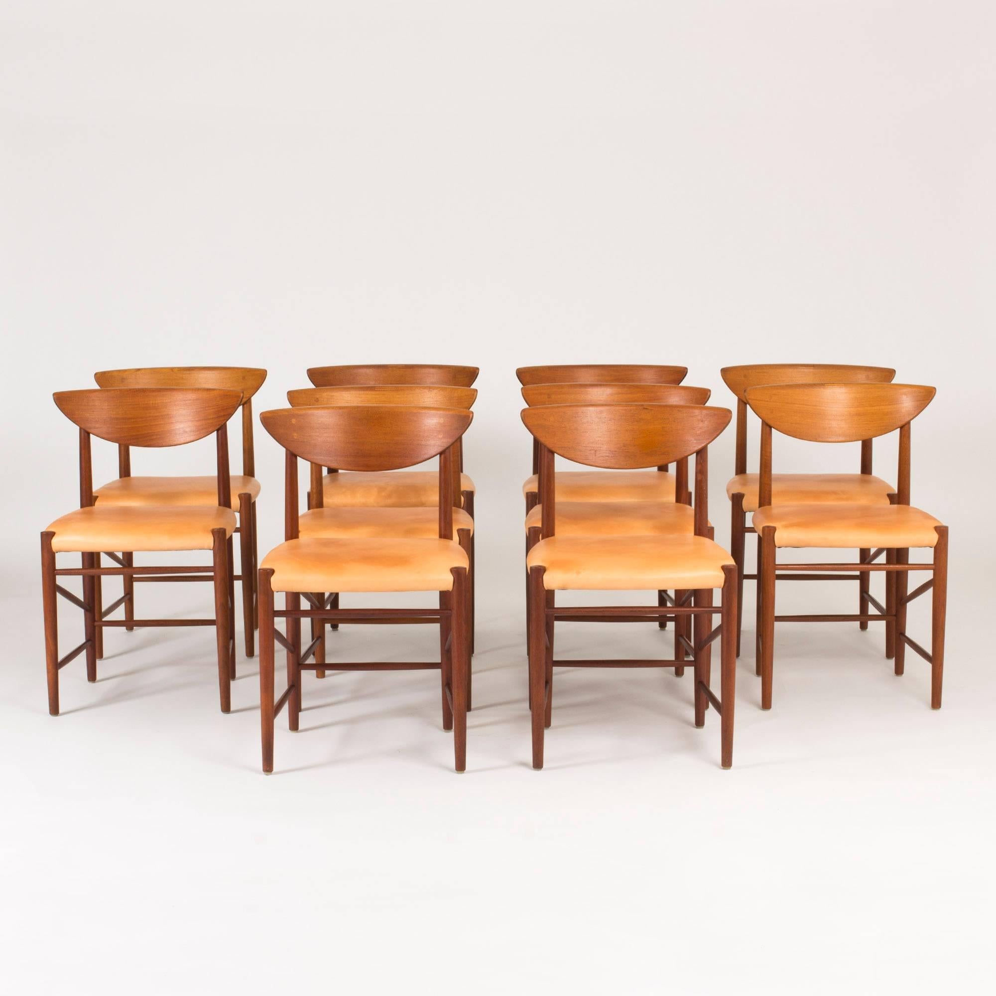 Set of ten remarkably elegant dining chairs by Peter Hvidt and Orla Mølgaard Nielsen, made in teak with nude leather seats. Slender legs and backrest with a curved upper edge and spheres covering the screw holes.
 