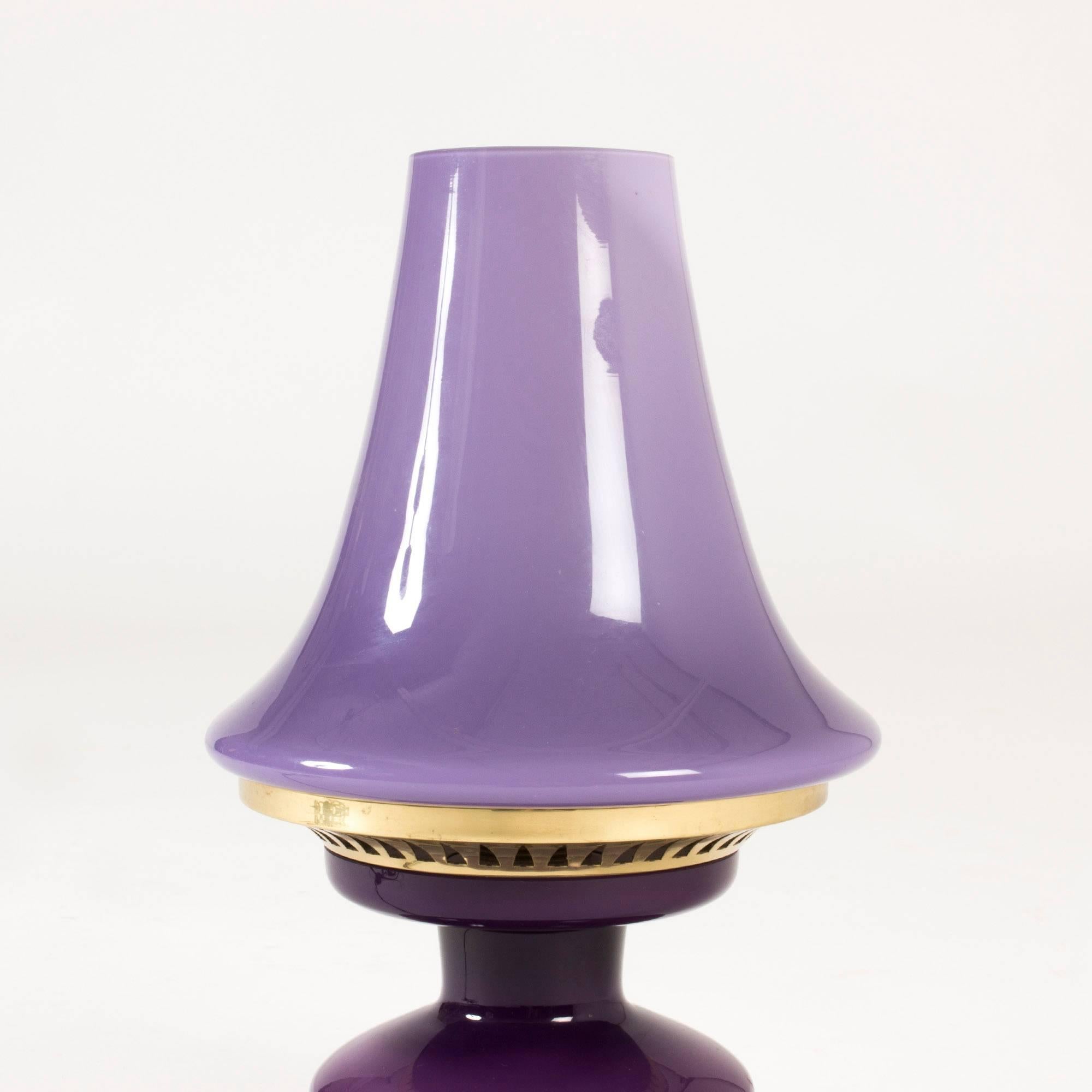 Adorable purple table lamp by Hans-Agne Jakobsson, made from opaline glass and brass, perforated in a graphic pattern. Gives a beautiful mood light when lit.
