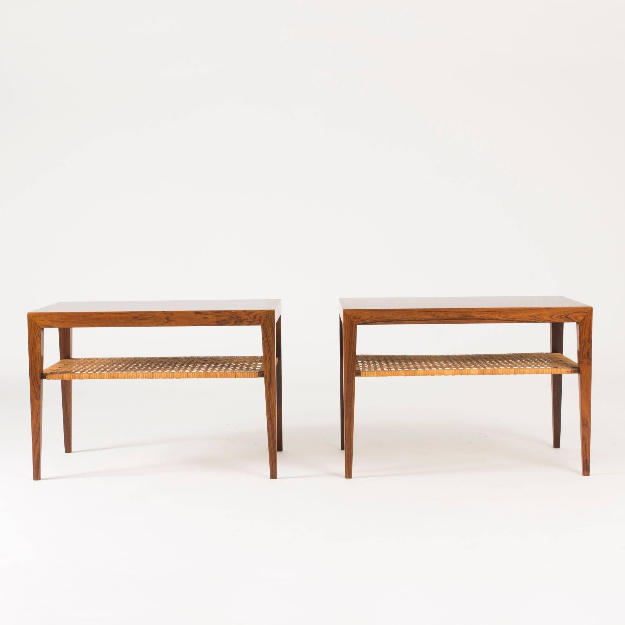 Pair of amazing rosewood side tables by Severin Hansen, with sharp silhouettes softened by the rattan shelves under the table tops. Beautiful wood grain.