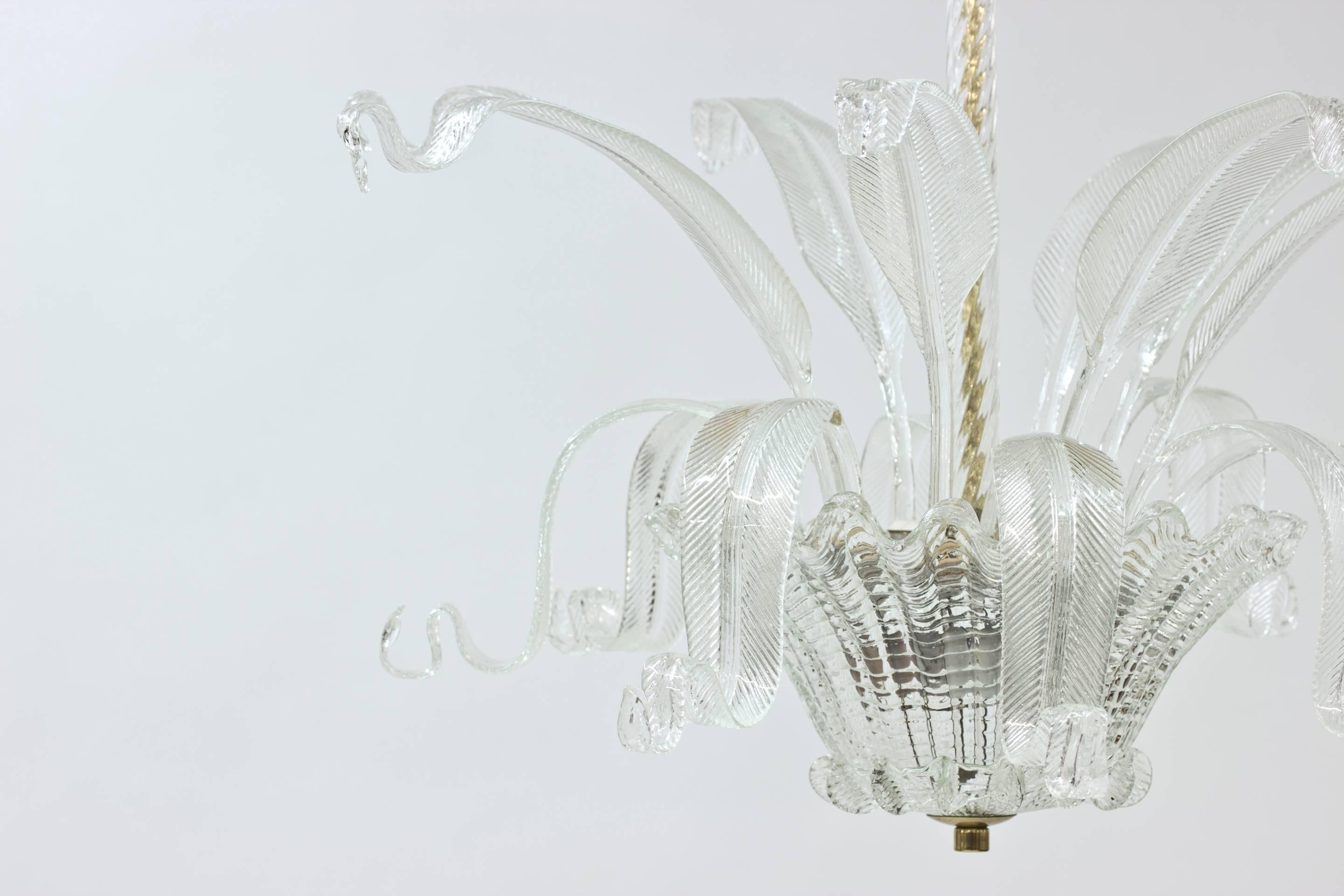 Exquisite chandelier by Fritz Kurz with featherlike glass decorations cascading joyously from the center. Made at Orrefors in the 1940s.