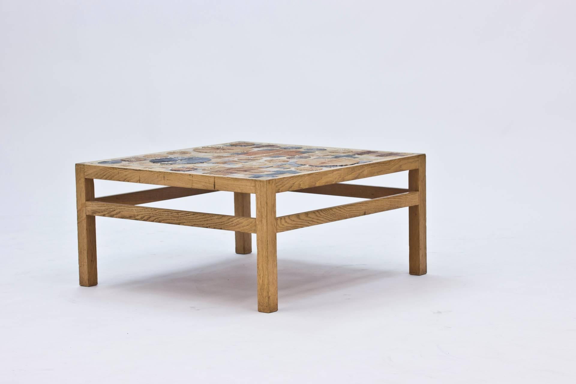 This table is the result of a collaboration between furniture designer Eric Wørtz and the artist Tue Poulsen. The blonde oak and the ceramic tiles creates a well balanced and amazing looking piece.