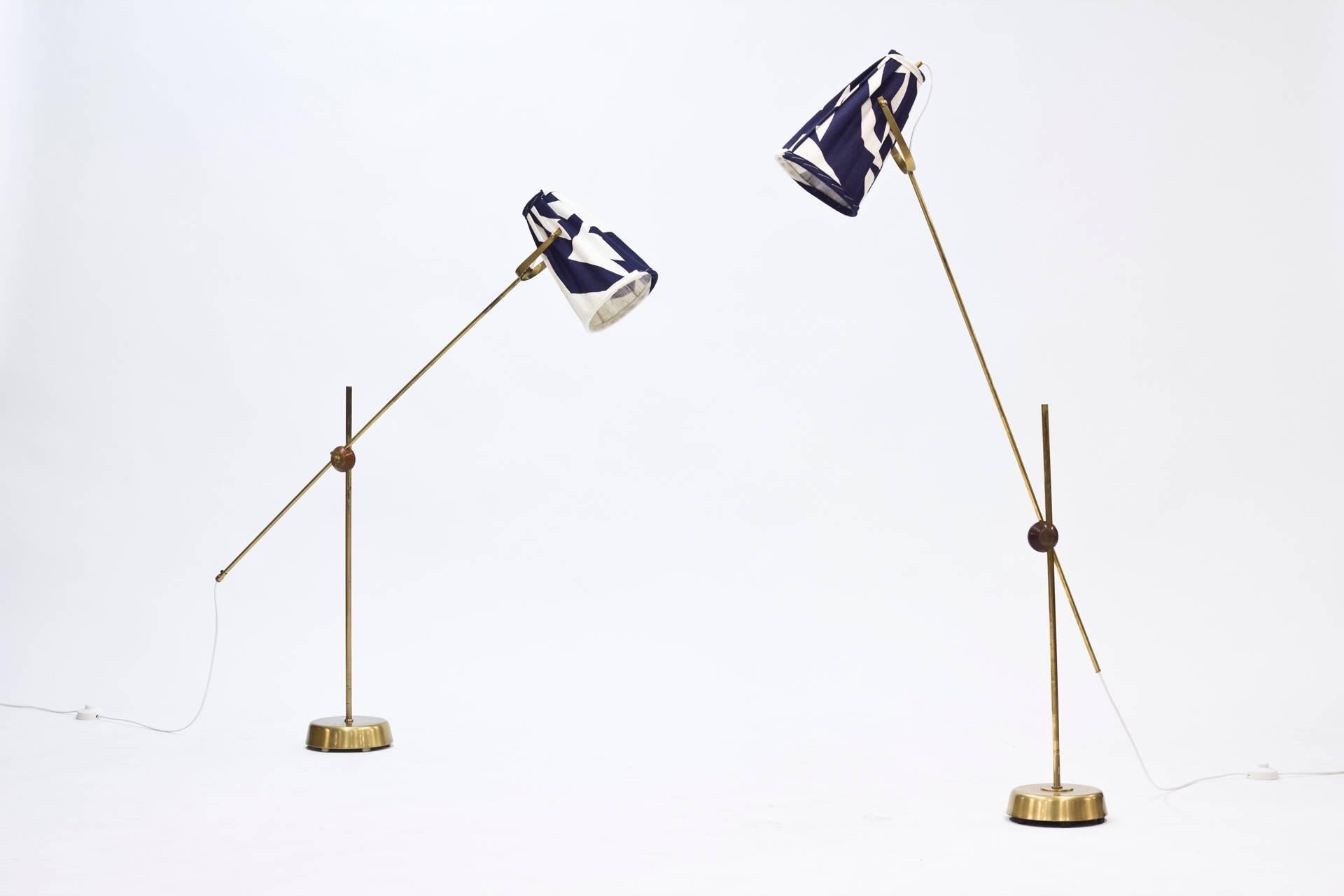 Awesome pair of floor lamps by Hans Bergström for Ateljé Lyktan. Combine the light, graphic lines typical of 1950s designs with the luxury and solidity of the brass. Can be extended and twisted into various heights and positions and the shades can