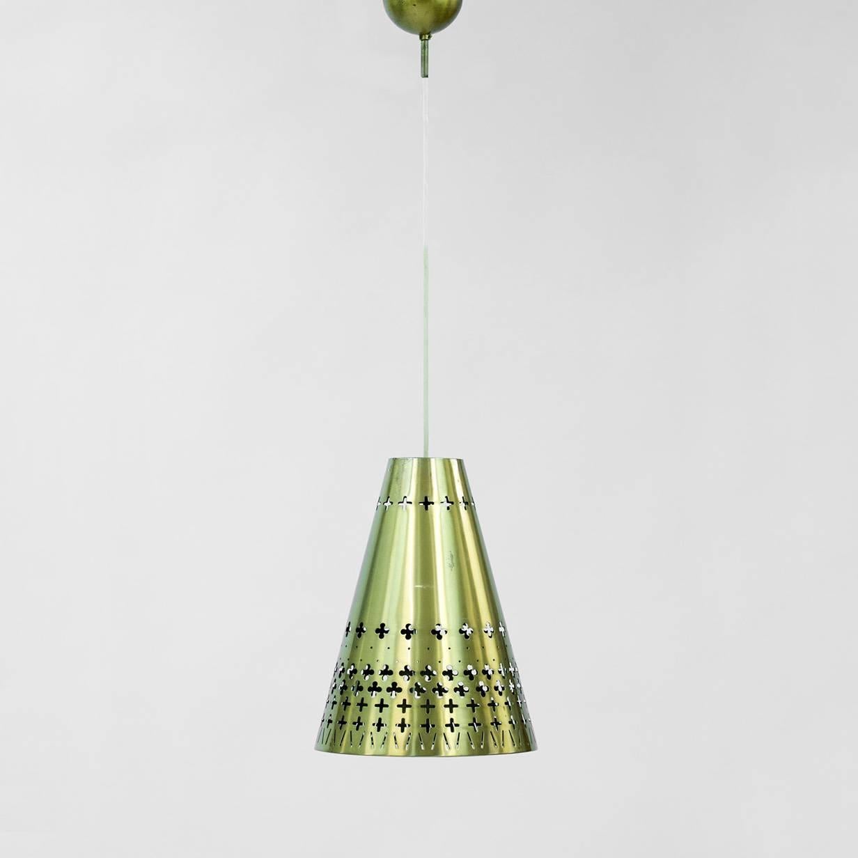 Gorgeous cone-shaped brass pendant lamp by Hans Bergström for Ateljé Lyktan. Beautiful punched out graphic pattern that lets through the light in a dramatic way. The cup for the cable is also brass, adding more elegance. New wiring.