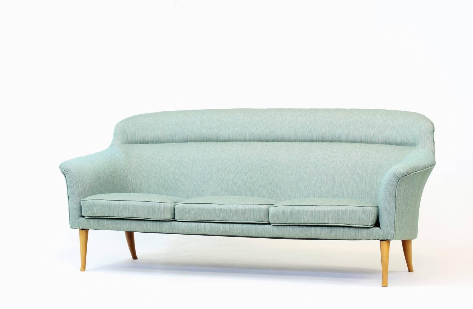 Extremely rare three-seat “Stora Familjen” (“Big Family”) sofa by Kerstin Hörlin-Holmquist for NK (Nordiska Kompaniet). Beech legs and original linen upholstery in very good condition.