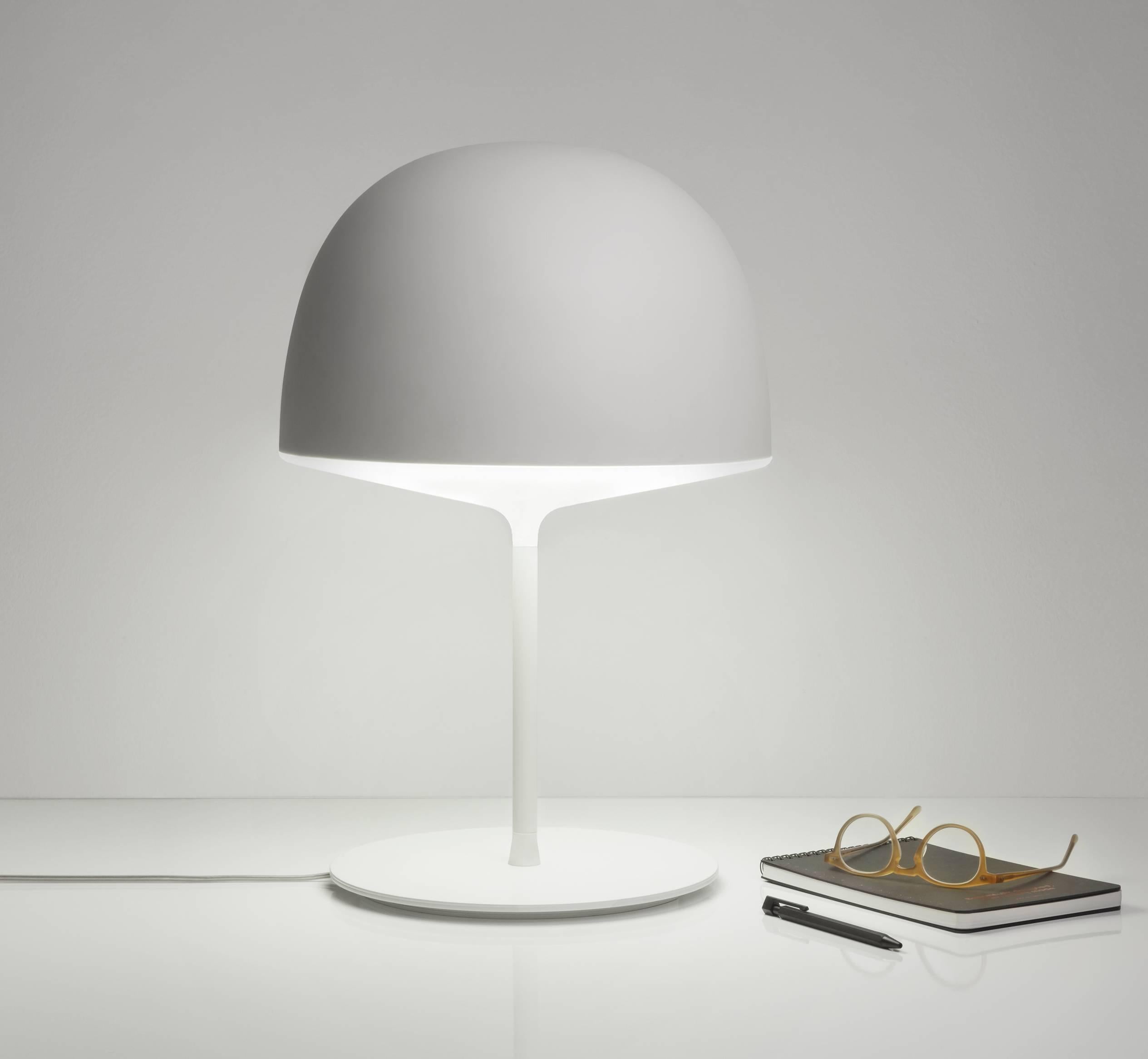 It echoes the studio’s Nordic imprint in its simplicity and functional aspects. The opaline polycarbonate diffuser ensures soft lighting, while the colored one spreads the light downwards.

Table lamp in tow versions:
Colored shade, stem and