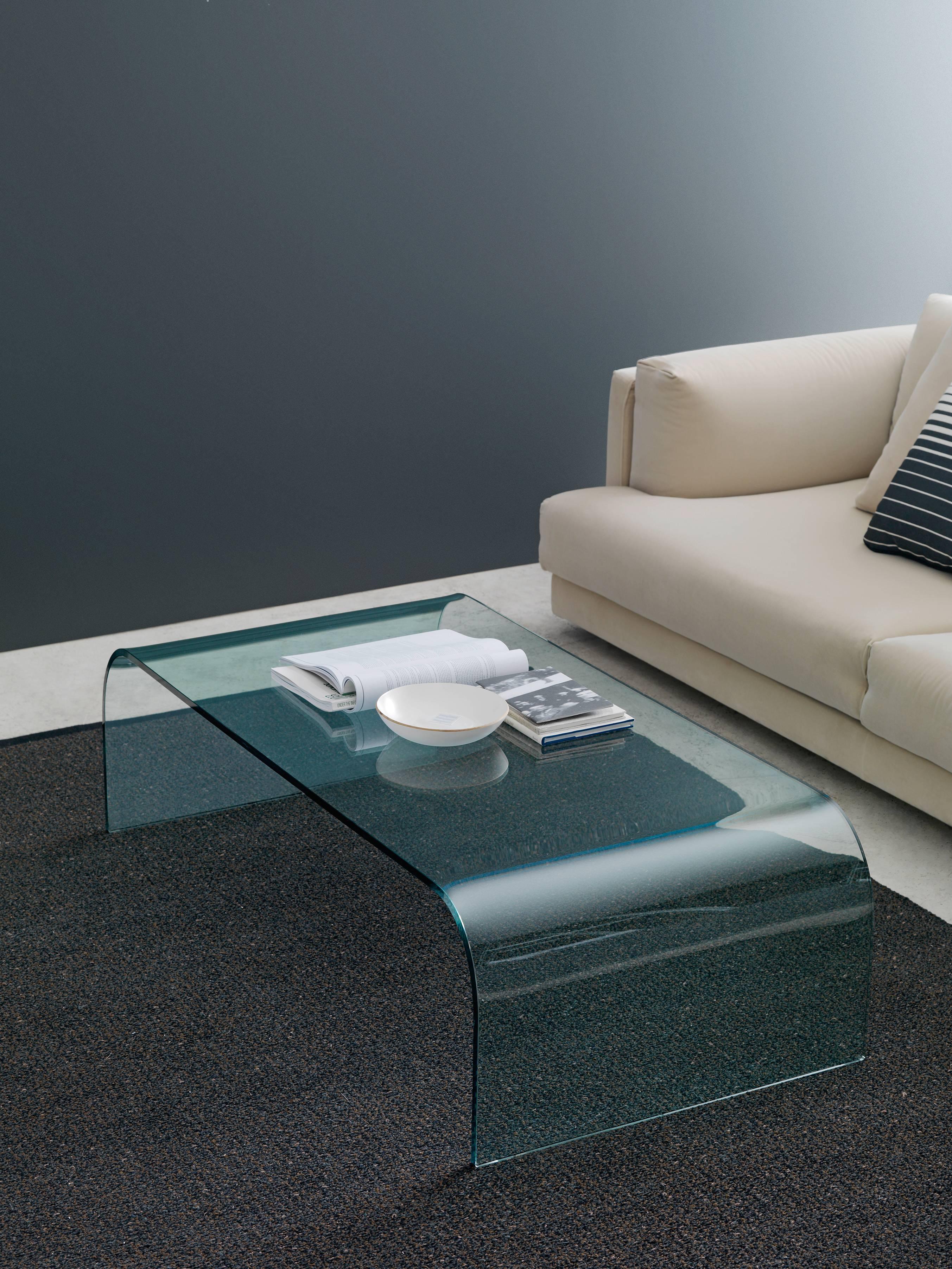 Designed by Pietro Chiesa, it was an extraordinary piece of essentiality and elegance. This coffee table is made from a double curved single piece of thick glass (15 mm). Available in four sizes. Measures: 2633/1 23.6” × 15.7” × 15.7”. $1,910.00