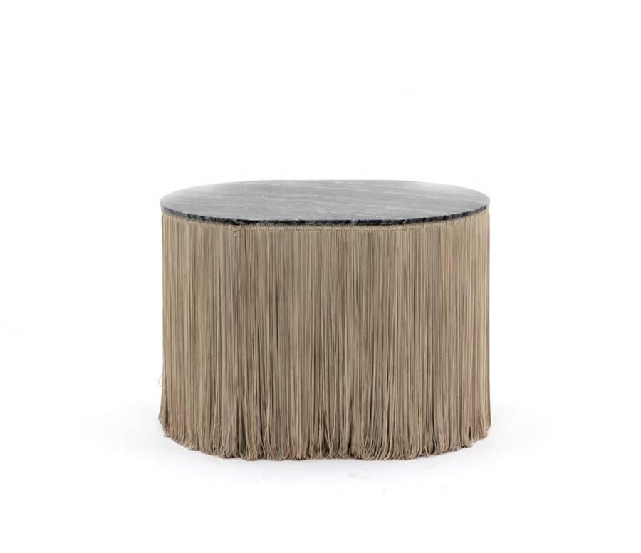 Tripolino S low table designed by Cristina Celestino for Spazio Pontaccio.

Series of three low tables in Striato Olimpico marble or silverware black marble with fringes in chromatic contrast.

Dimensions: 27 x 19 x H 17.