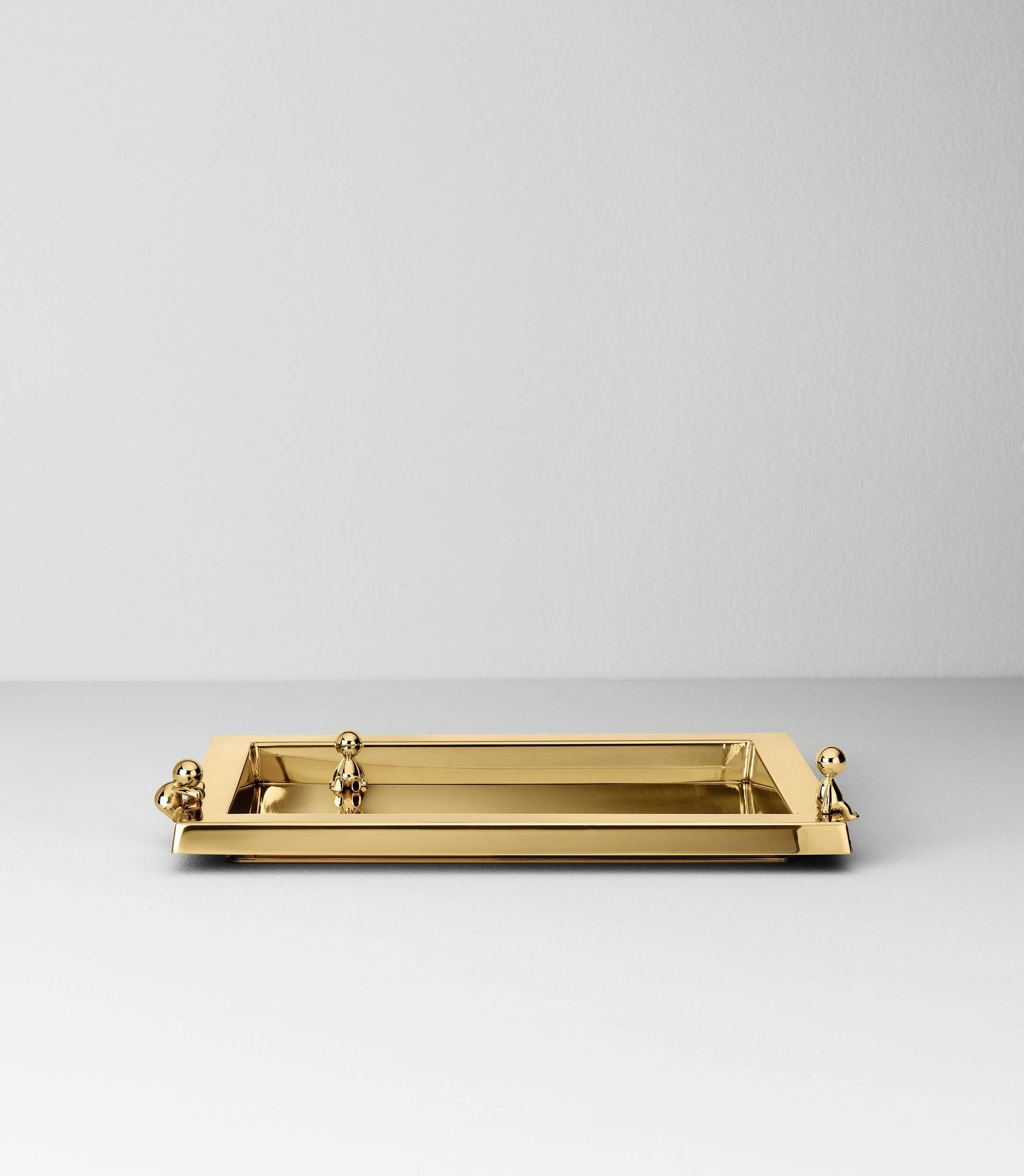 Serving tray in stainless steel finished in polished brass designed by Stefano Giovannoni.