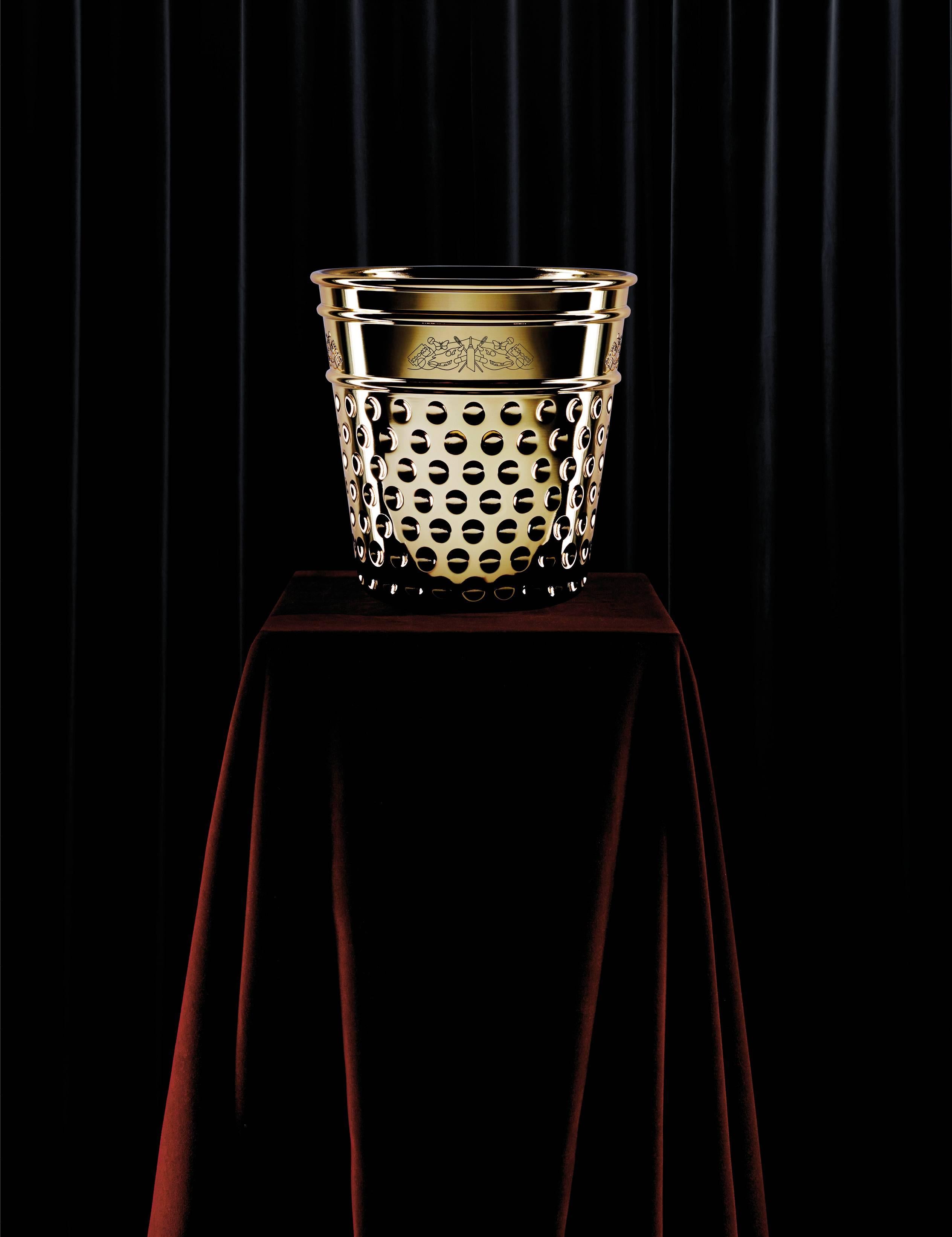 Ice bucket in casted polished brass designed by Studio Job.