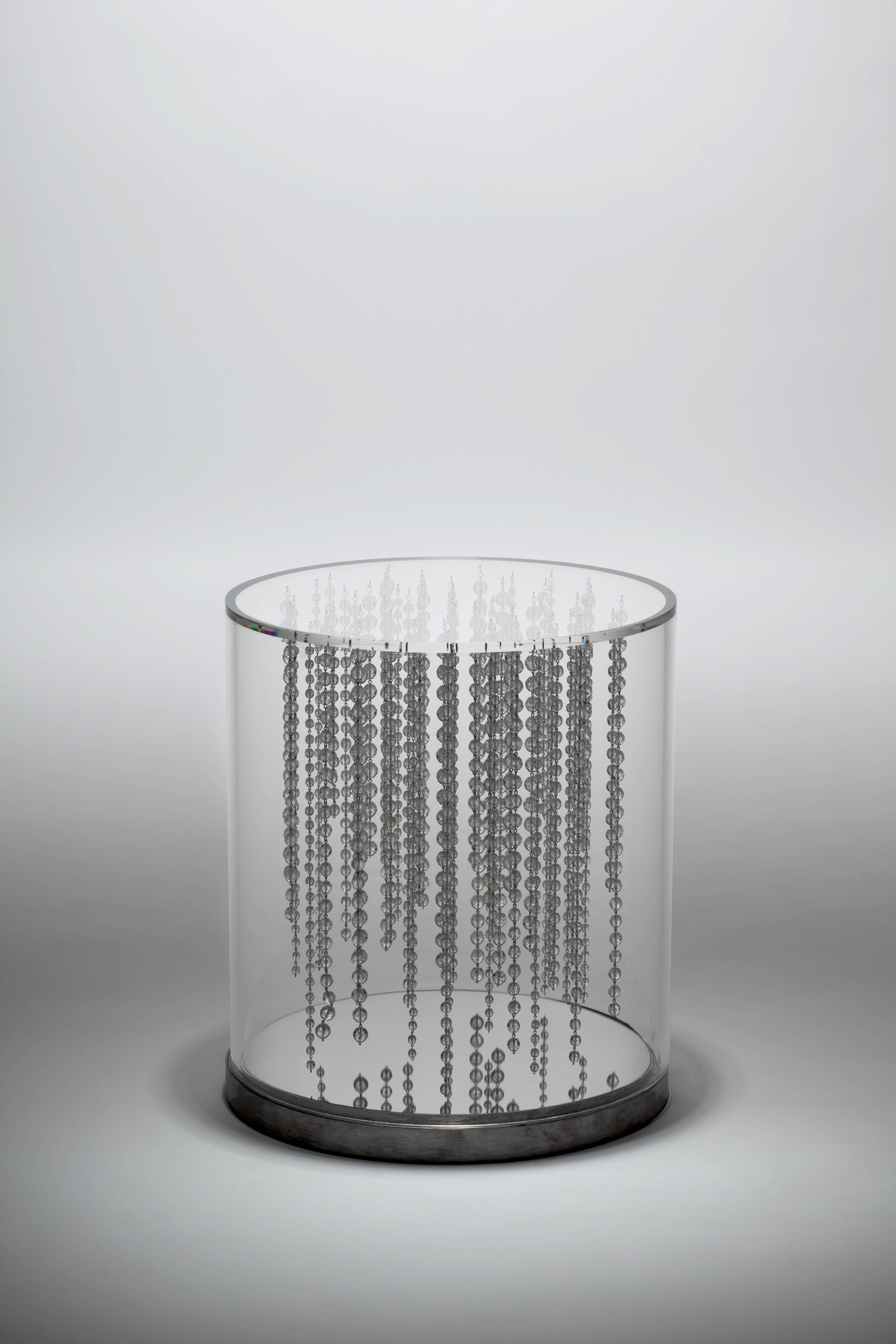 Pluie side art table by Liana Yaroslavsky

Czechoslovakian crystals, one way mirror, LED lights, plexiglass, steel.
Dimensions: ø 400 x 450 mm.

         