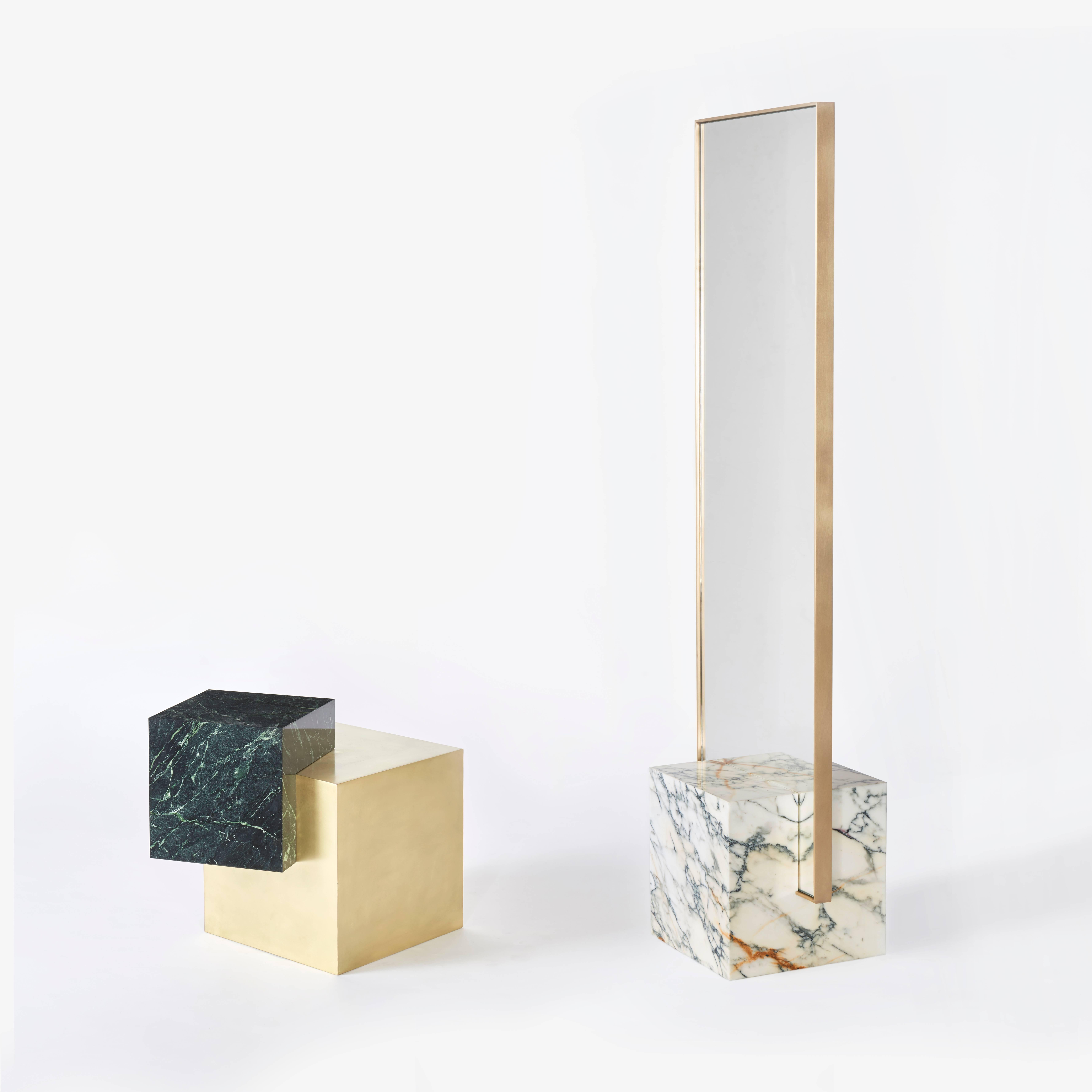 Polished marble cube brushed brass mirror frame.

Dimensions: 68” H x 20” W x 14” D.