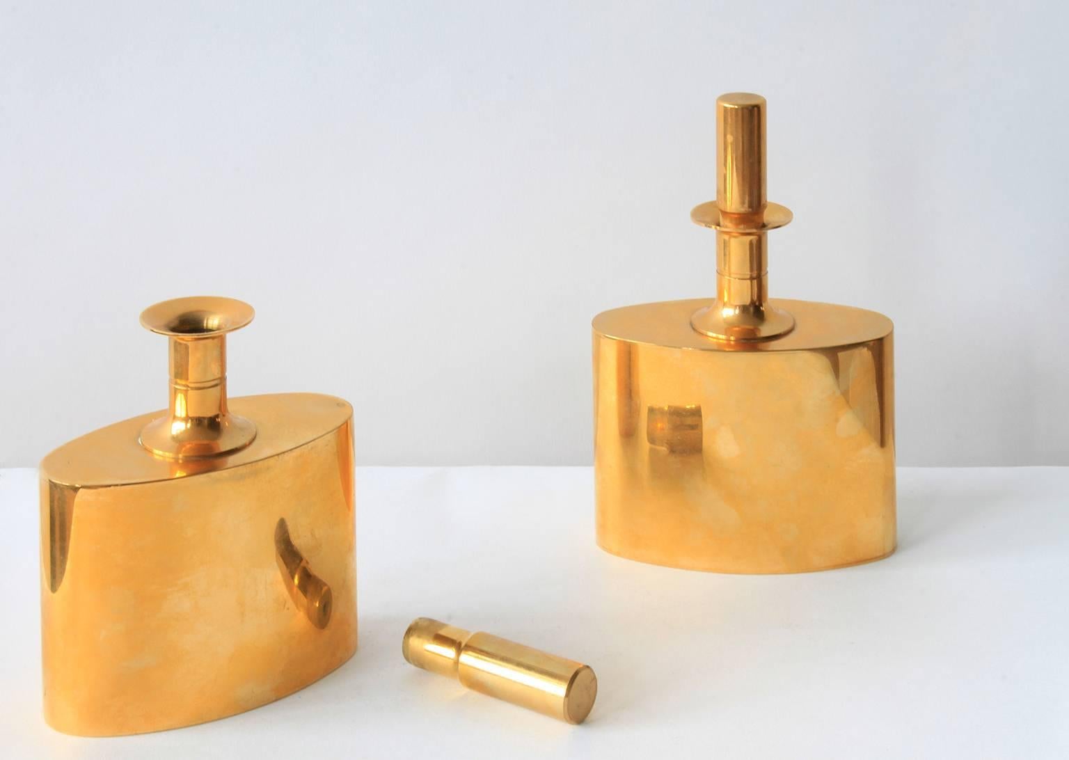 A pair of gold lacquered brass schnapps flasks by Pierre Forsell for Skultuna.