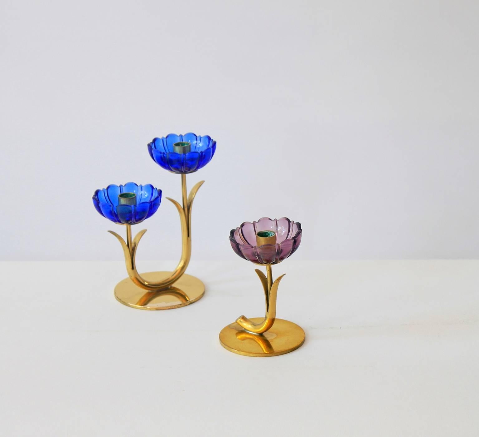 A softly colored flower candle holder by Gunnar Ander for Ystad-Metall.
This example comprises a purple glass flower on a gold-plated brass stem.