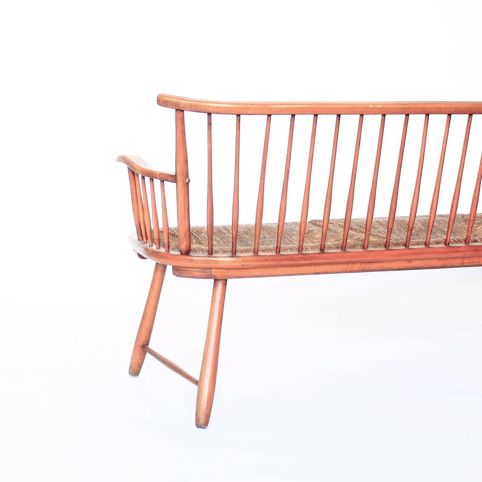 Rare Shaker-style bench from Germany with charming rush mat seating. Designed by Arno Lambrecht. Manufactured in Germany by WK-Sozialwerk. We use as an entry hall bench or in a dining setting. Lambrechts pieces are simple, pure and display a