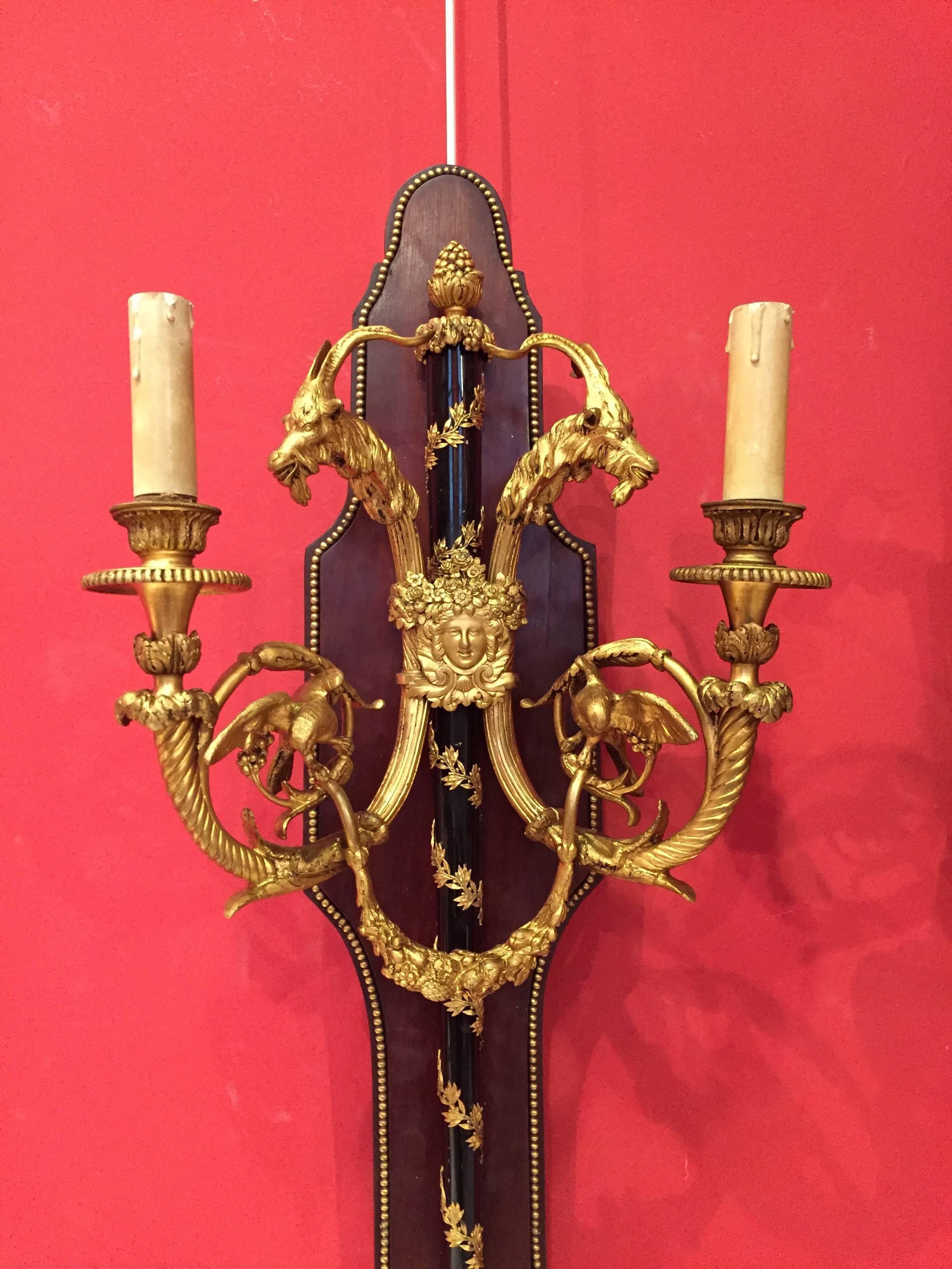 A pair of 19th century French gilt bronze sconces.