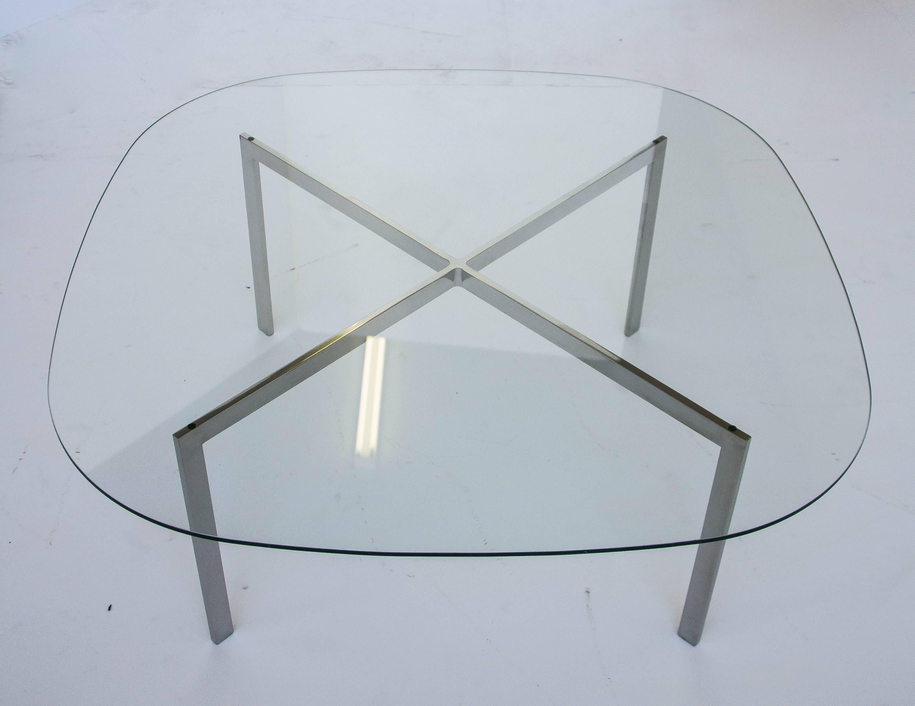 Original Ludwig Mies van der Rohe for Knoll Barcelona table base with new glass. The single piece construction polished stainless steel base is a Classic in minimal design. Stamped 