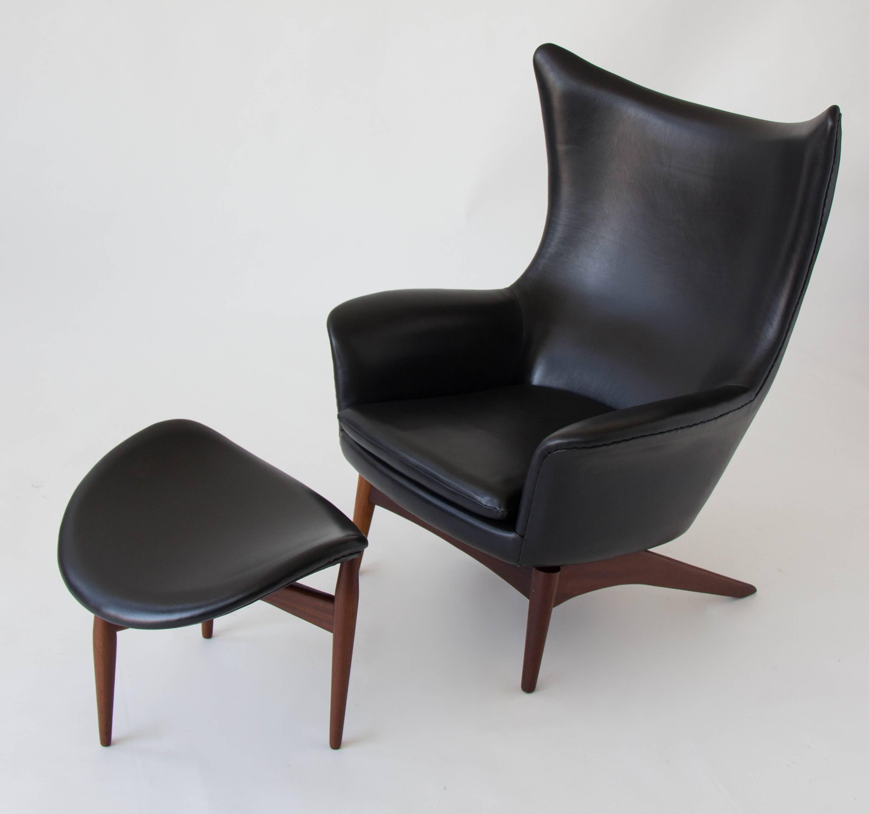 A leather-upholstered lounge chair and ottoman set designed in 1963 by H.W. Klein for Bramin Møbler. The chair has a rounded design with a subtle wing back and reclines at five set angles of repose, adjusted with a knob on the right-hand side of the