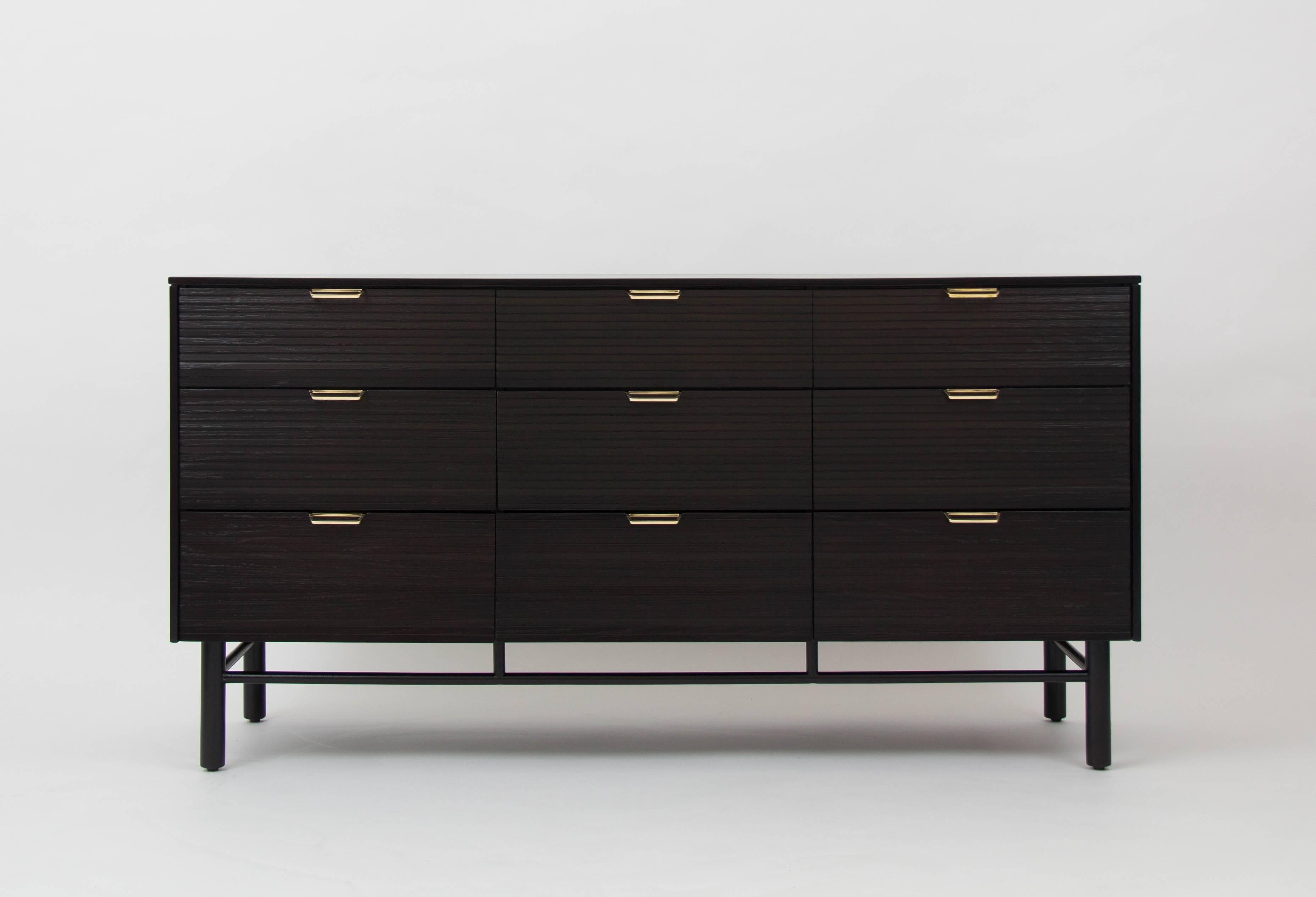 This dresser of ebonized oak is from Raymond Loewy's 1953 collection ,