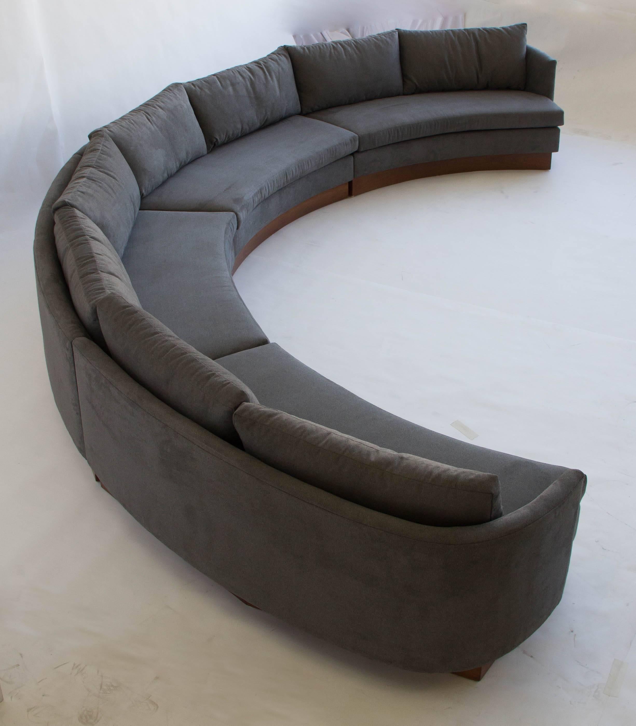 This large semi-circular sofa was made by Carson's of Highpoint North Carolina in the 1970s. Milo Baughman once designed for Carson's but there is no documentation of this piece stating that it is in fact Milo Baughman. 
Each of the four sections