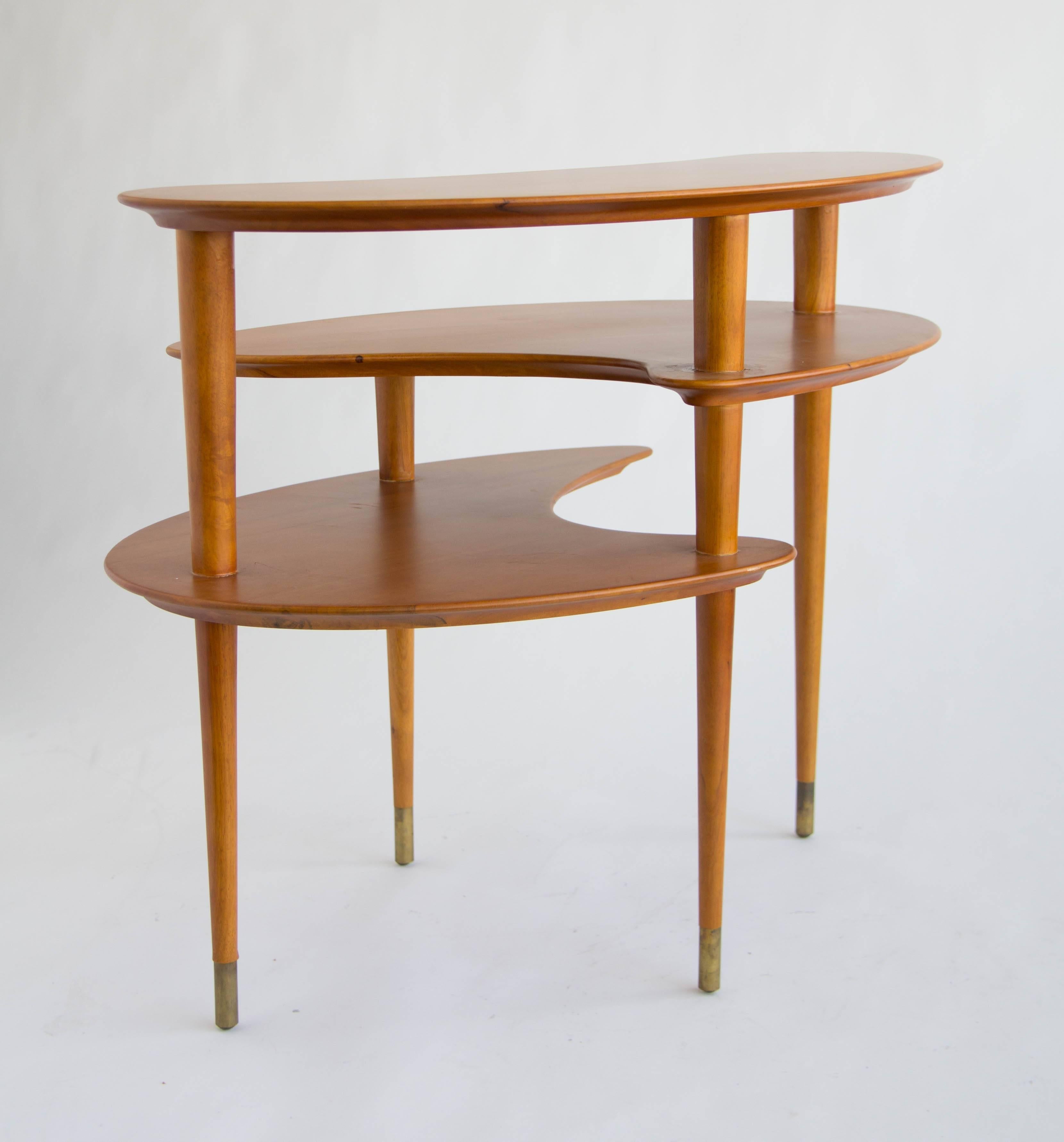 Side table by John Keal for Brown Saltman. Solid teak tops supported by four solid legs finished with brass tips.