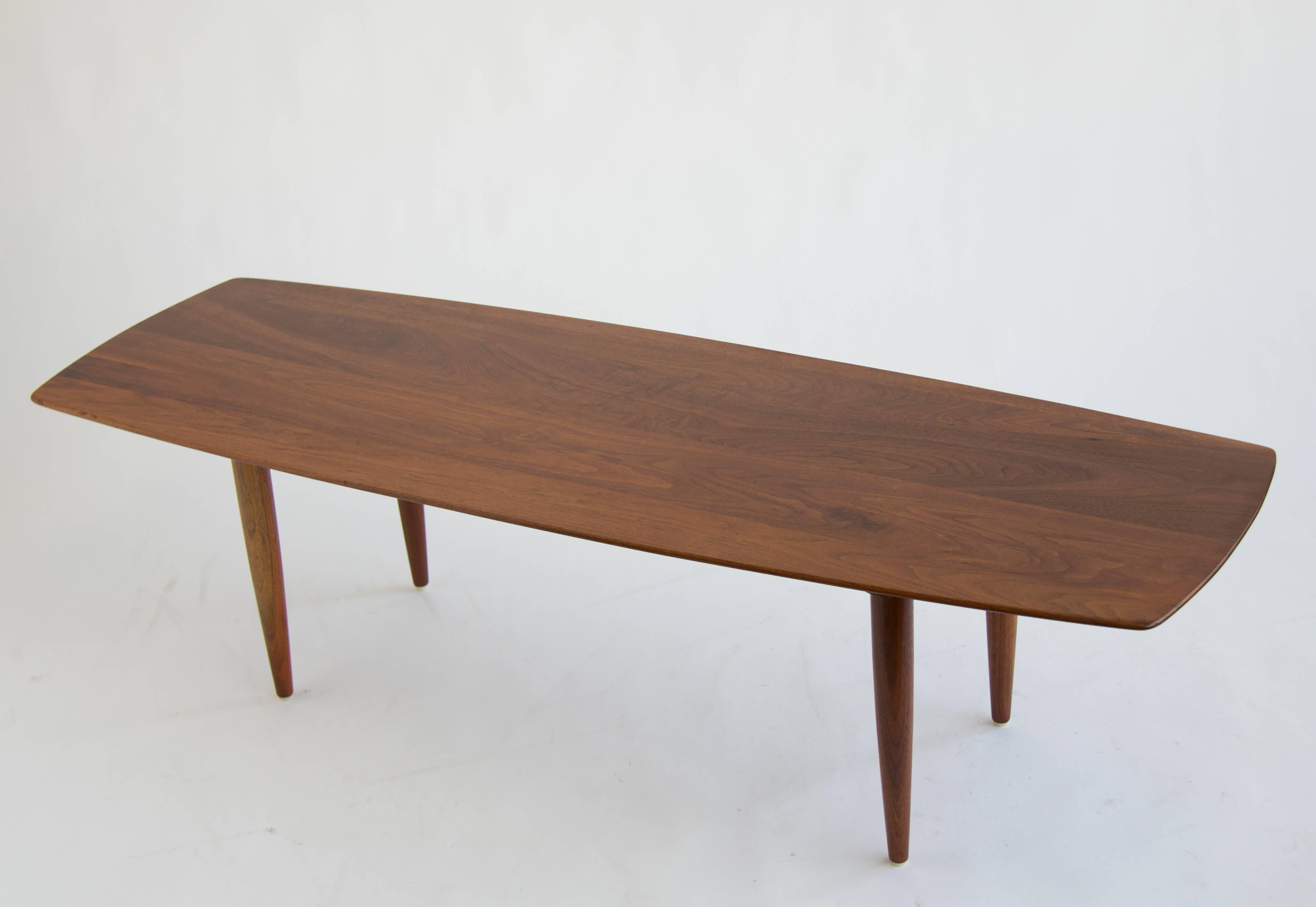 Solid walnut coffee table made by California based furniture maker Prelude. Stamped 