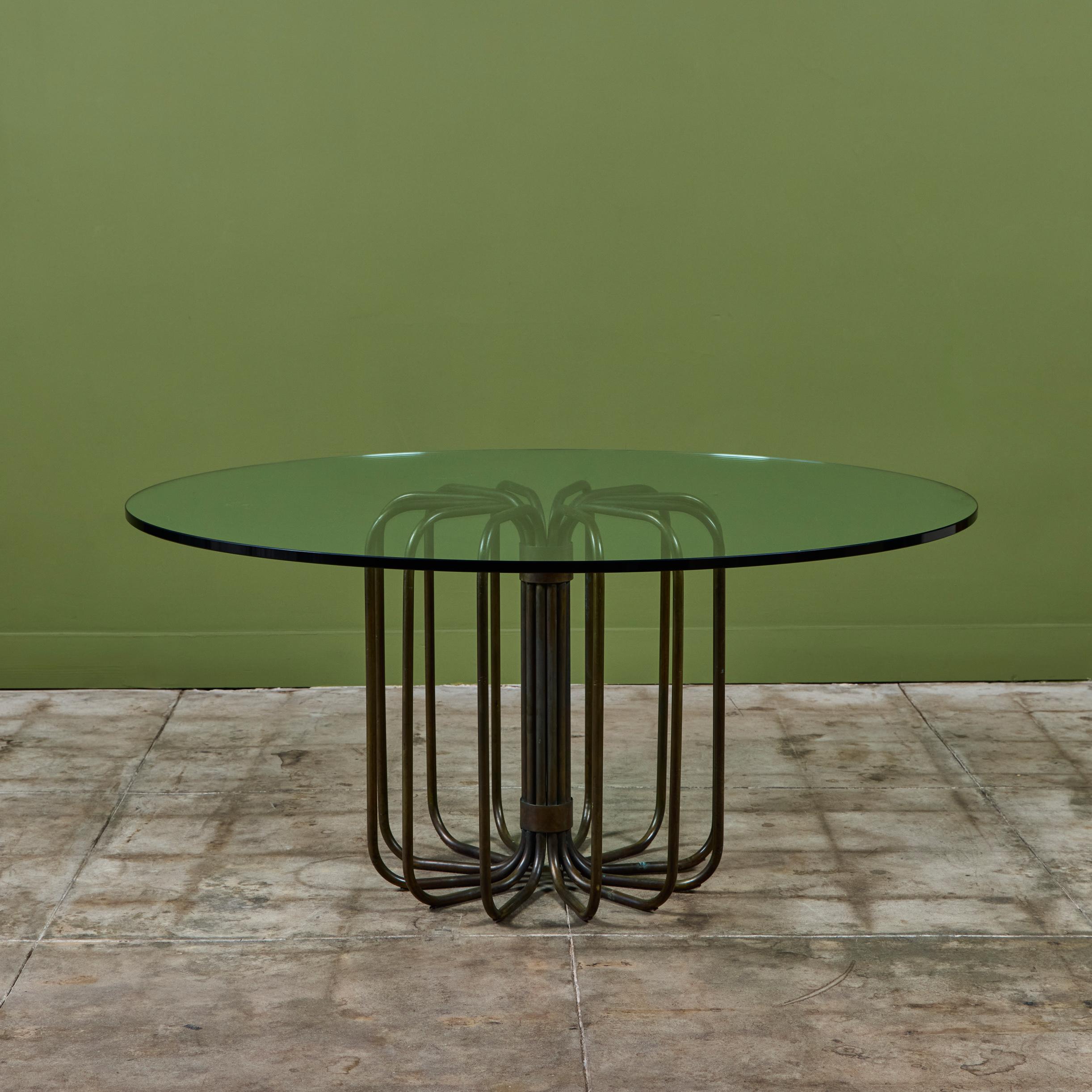 Patio table by Kipp Stewart for Terra of California, USA, c.1970s. The table features a curved patinated bronze tubing pedestal base of with a 60