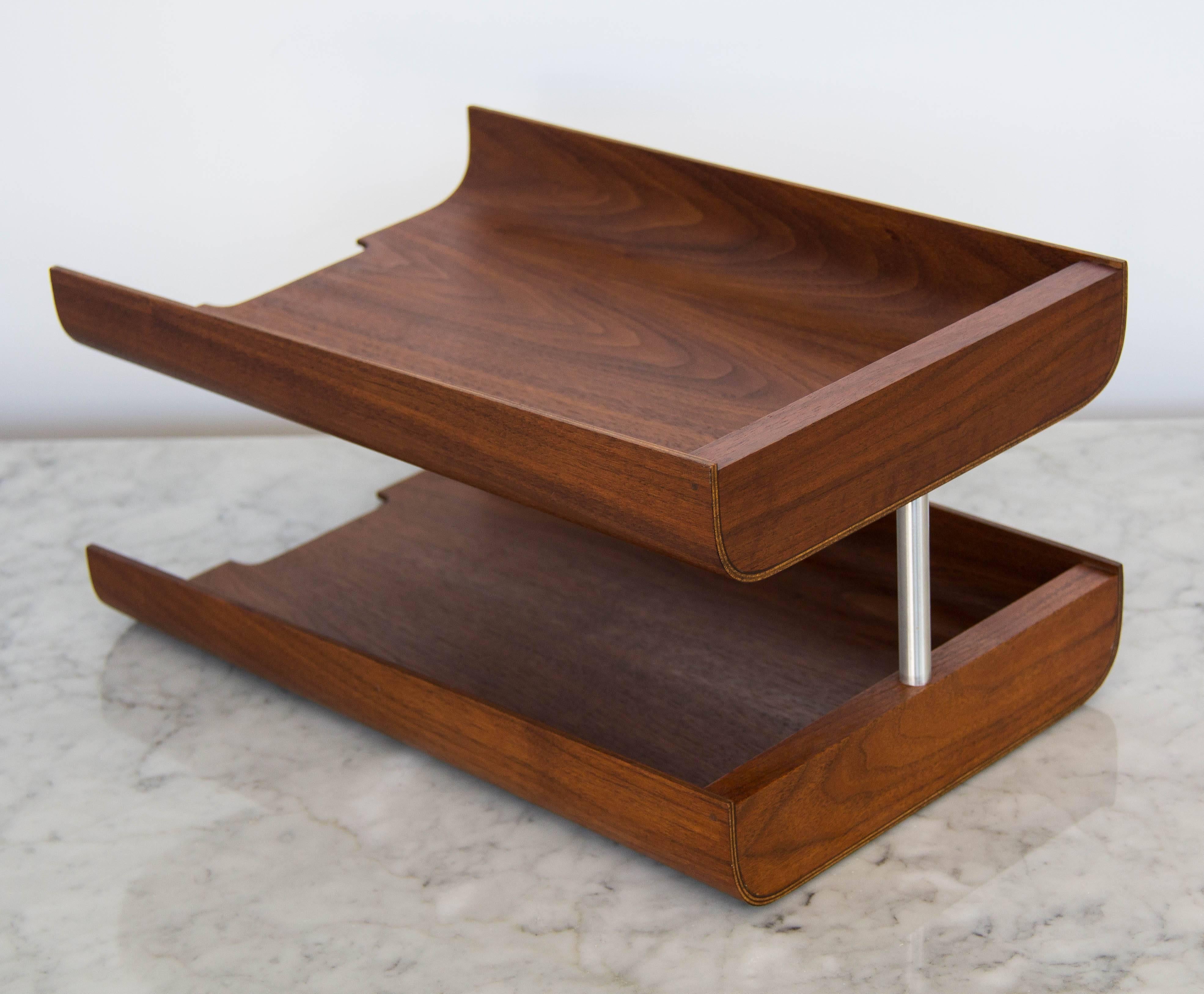 Swedish design house Rainbow Wood products specialized in streamlined home accessories in teak veneer. This paper tray has two tiers with a wedge-shaped design and notched edges, connected by a brushed steel post.

Condition: Professionally
