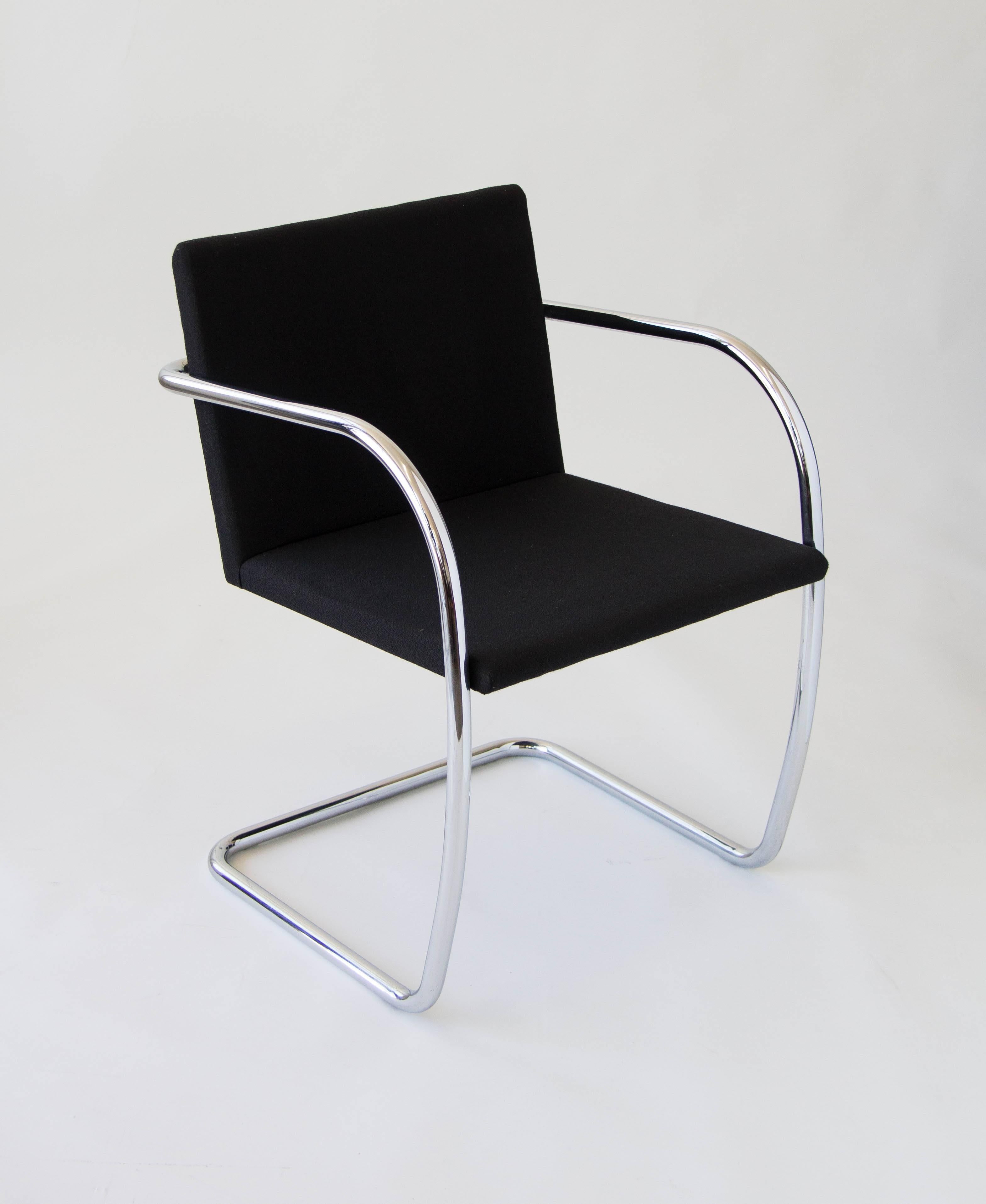 Designed in 1930 by Ludwig Mies van der Rohe for the Tugendhat House in Brno, Czech Republic, these were produced by Knoll International in Italy. Each chair has a cantilevered tubular steel frame and a floating seat in the original black
