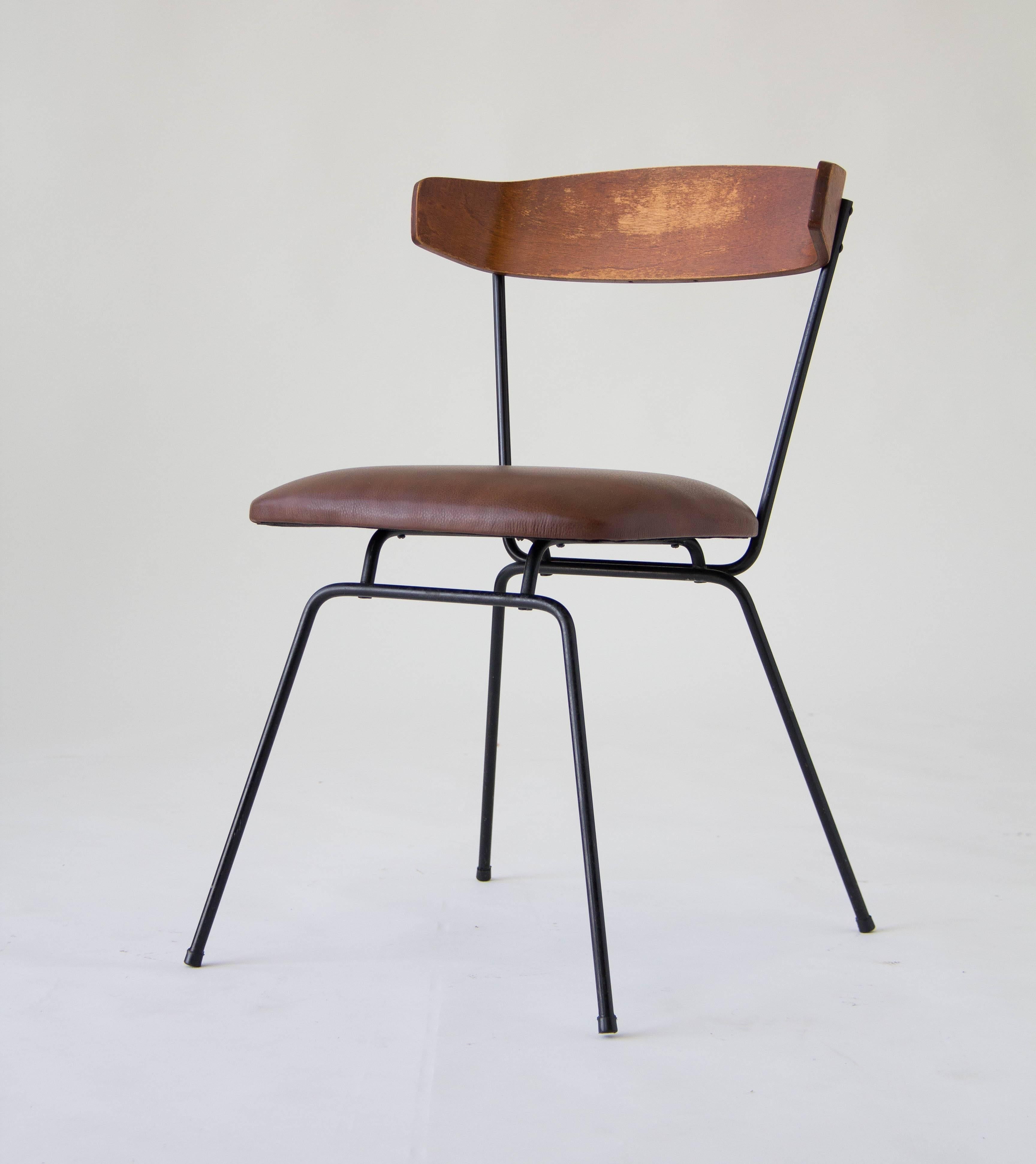 A single model SD3810 chair by Clifford Pascoe for Modernmasters Inc. Features a wrought iron frame, upholstered seat and a bent walnut backrest. The wrought iron legs are delicately splayed and tipped with plastic glides to protect surfaces. The