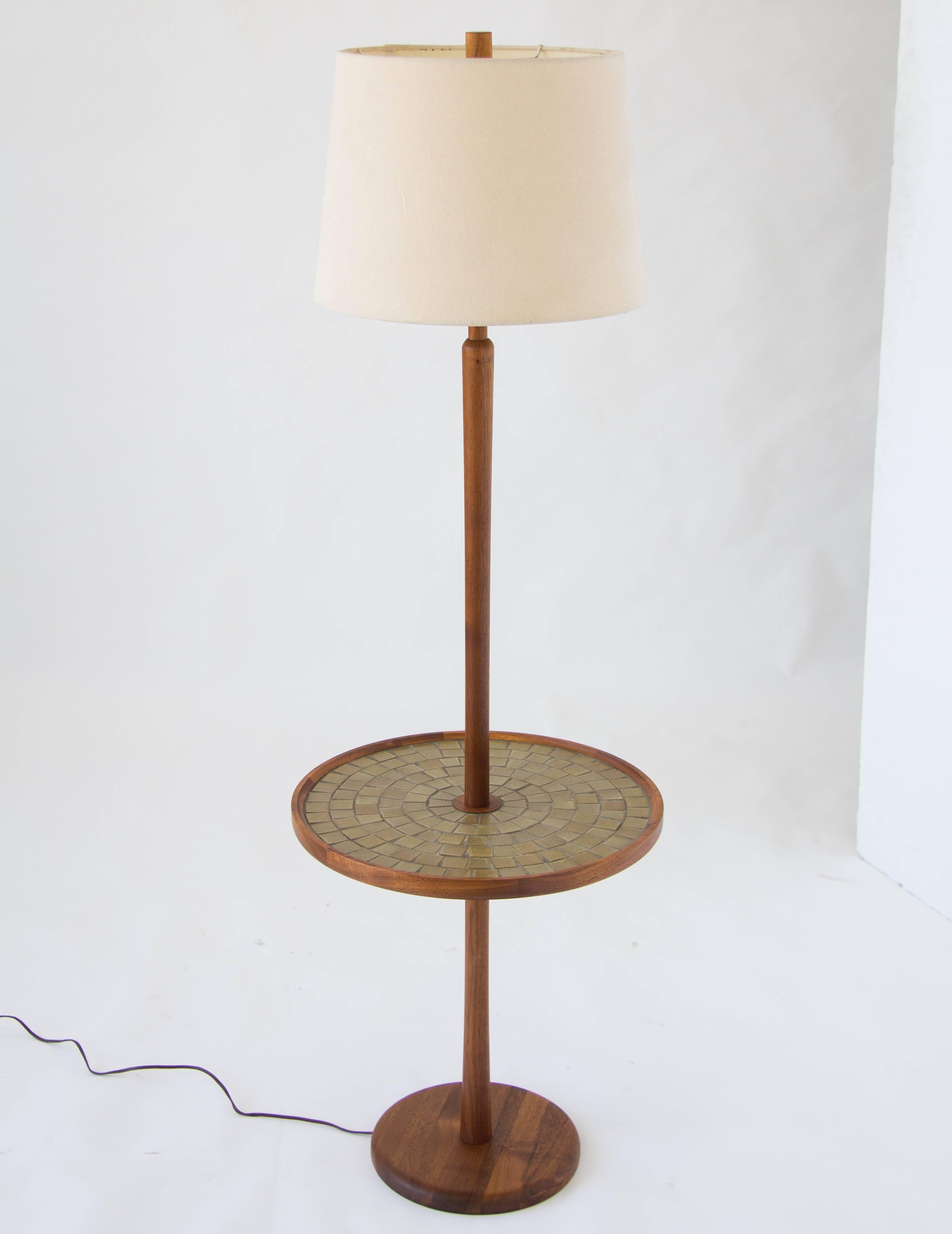 Classic design by Gordon & Jane Martz for Marshall Studios with construction in solid walnut. The floor lamp has a walnut column, ringed by a tabletop inlaid with a mosaic of square ceramic tiles. Visible lighting components are brass, with a