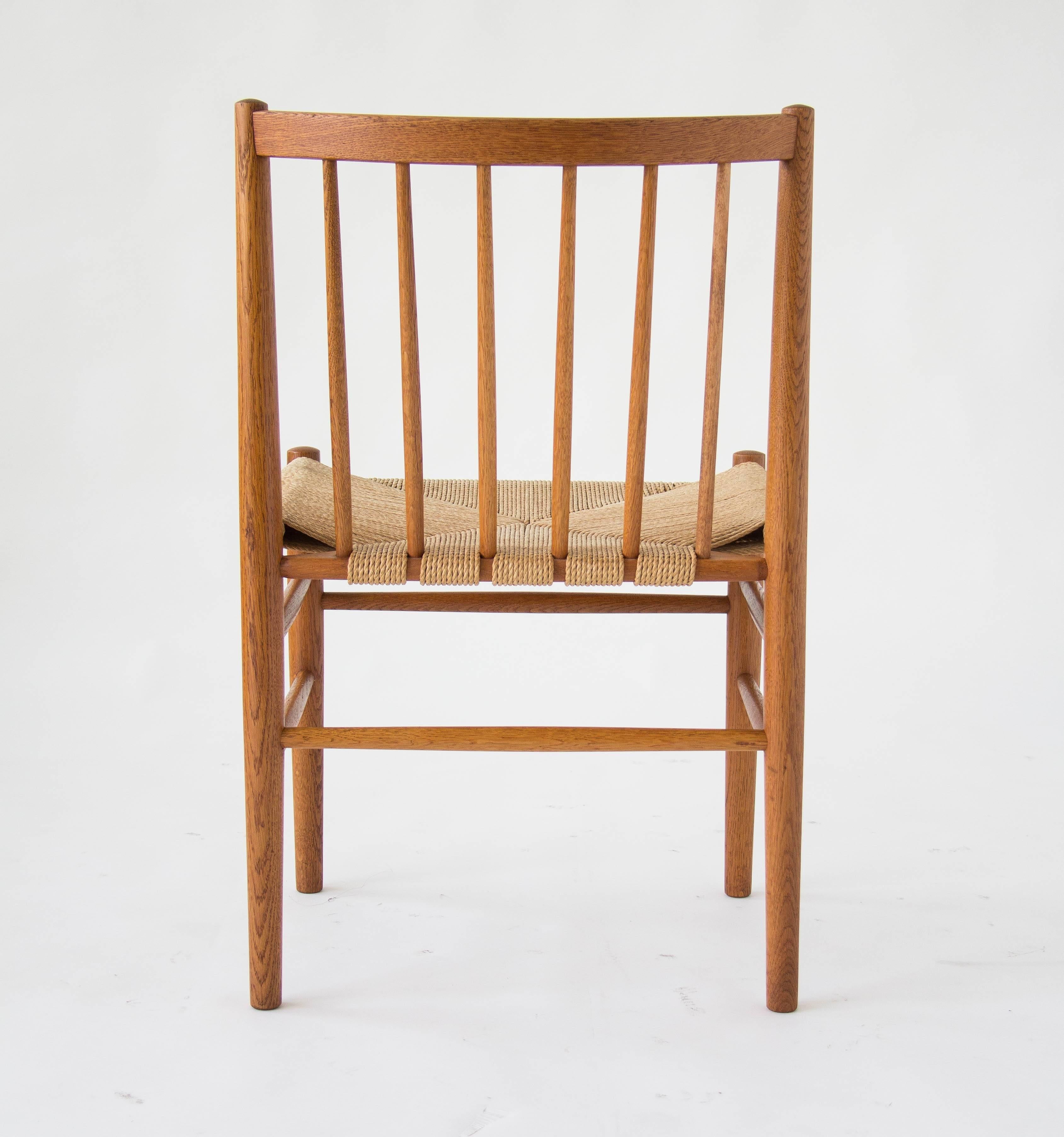 Scandinavian Modern Six Spindle-Backed Oak and Danish Cord Dining Chairs