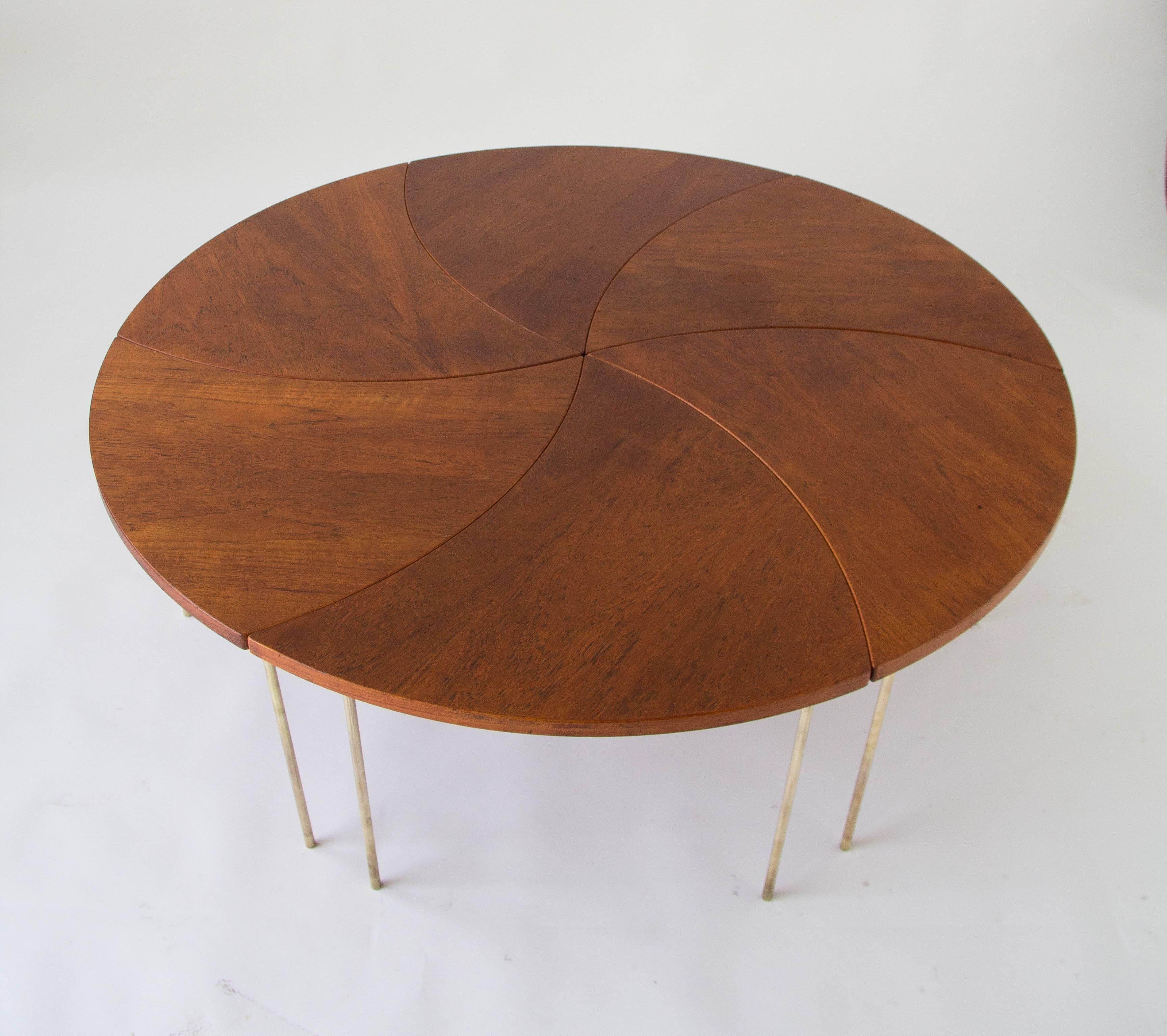 A set of six modular Model FD523 tables by Peter Hvidt and Orla Mølgaard-Nielsen for France & Daverkosen in 1952. The table, which has a teak top and slender brass legs, was imported to the United States by John Stuart of Grand Rapids. The segmented
