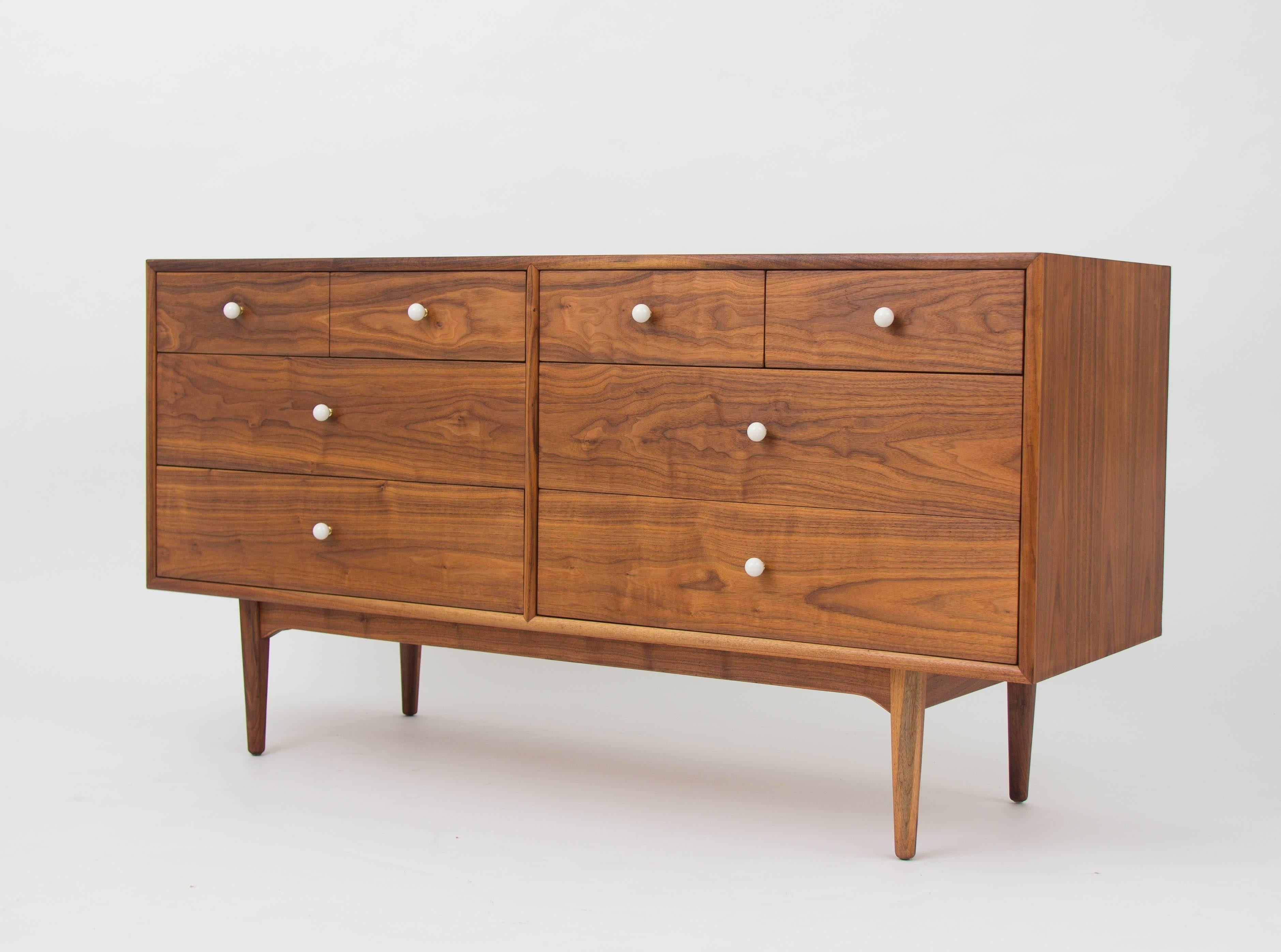Drexel dresser
Walnut dresser from Drexel’s popular Declaration collection by Kipp Stewart and Stewart MacDougall. This example has a walnut case holding eight-drawers with original white ceramic knobs on brass spacers. Each of the two-drawer stacks