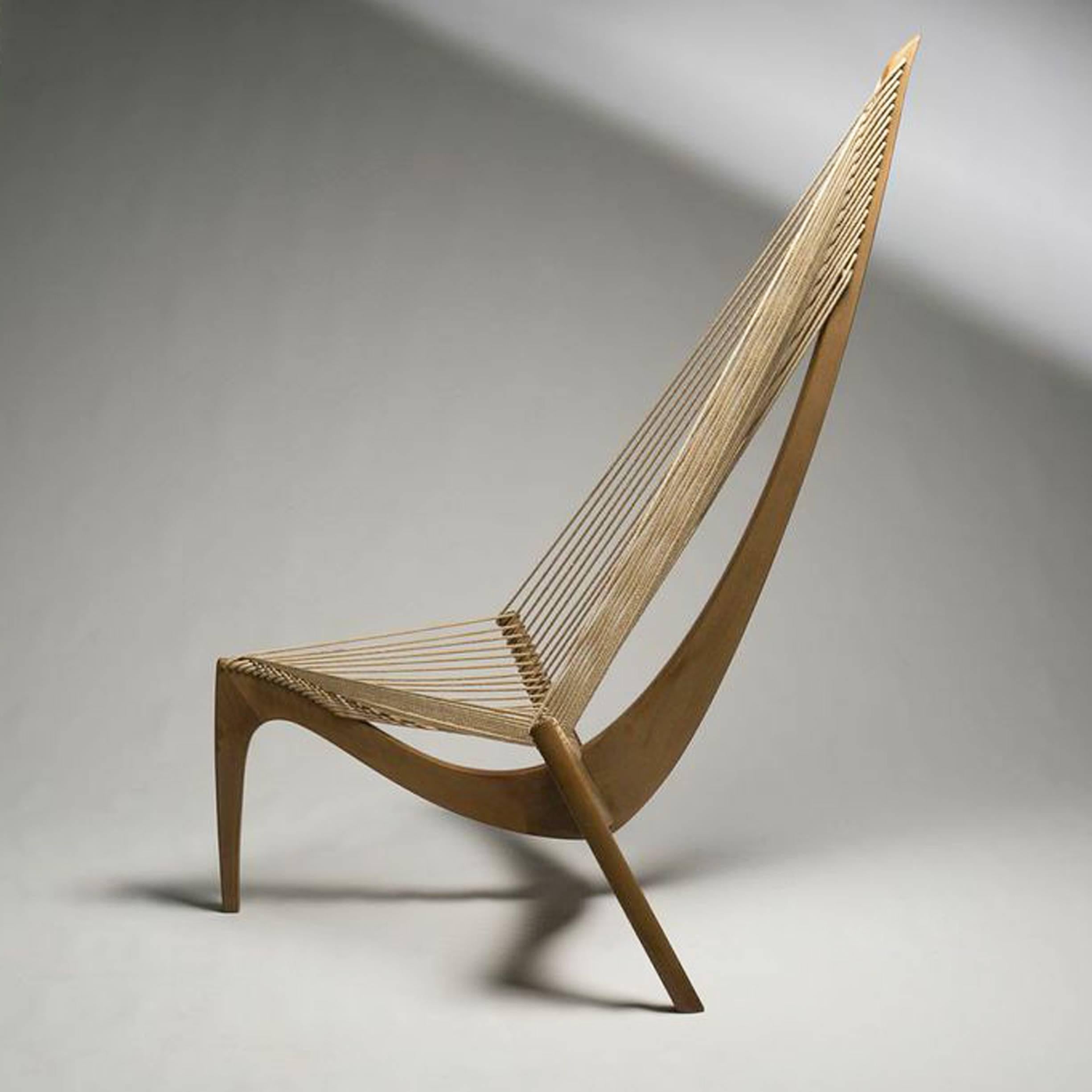 The striking appearance of the Harp Chair was inspired and based on the bow section and hallyard of a Viking ship. The idea behind it was to create a cultural object that was enjoyable and comfortable to sit in while giving a pleasing design for the