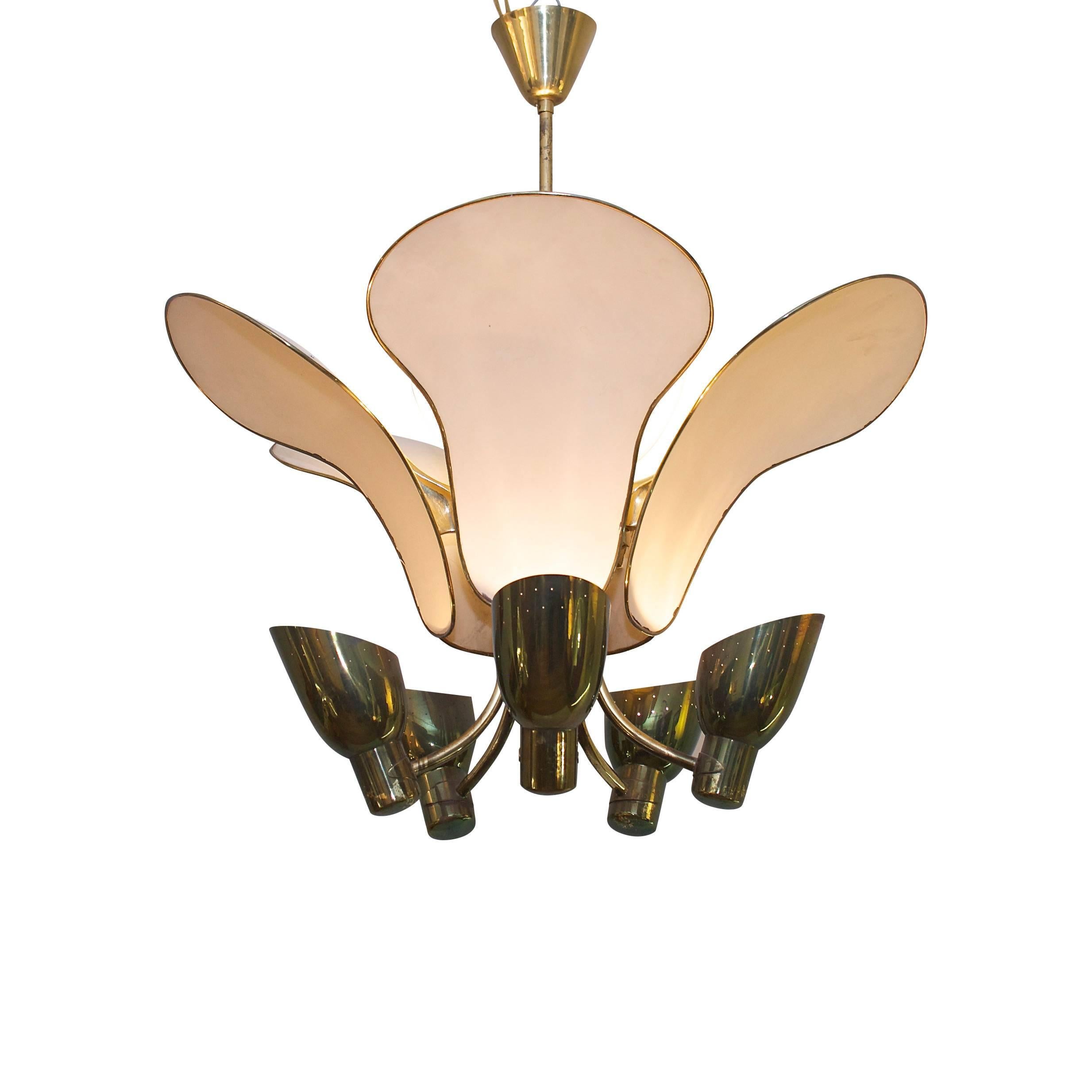 Carl Axel Acking (1910 . 2001)
Monumental Scandinavian Brass Chandelier Late 1940s. 
A very impressive Midcentury stamped hammered and polished brass chandelier with cream coloured reflectors and perforated shades. Glass insert bowl shade. In