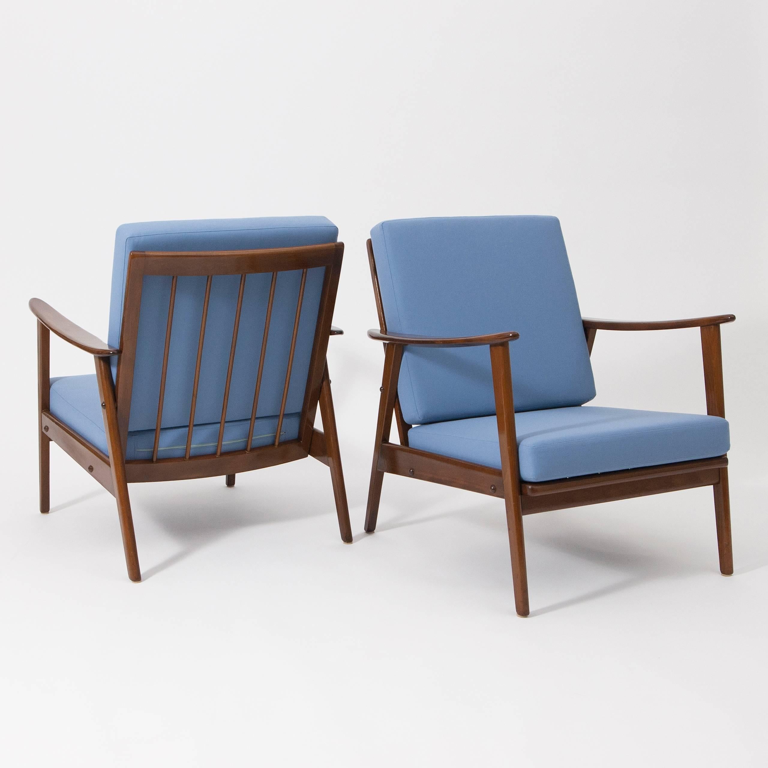 Beautiful pair of Mid-Century Modern easy chairs from the German, 1960s. Frame made of walnut wood, solid construction, re-upholstered with cushions in a high quality soft blue fabric.
Excellent condition.