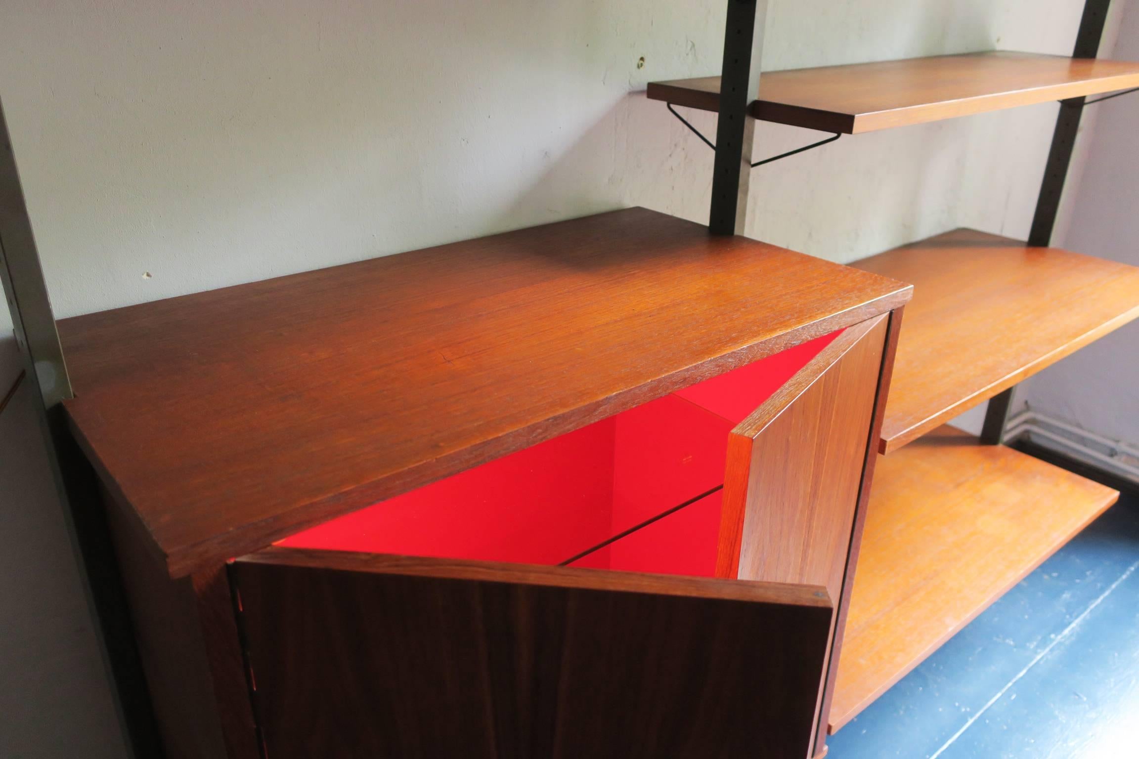 Rare Swedish teak modular shelf system by Olof Pira, 1960s.

One cabinet lights up on opening to reveal the red interior.

*Shipping to UK and Continental Europe: the prices given below on the listing only apply to certain areas on account of the