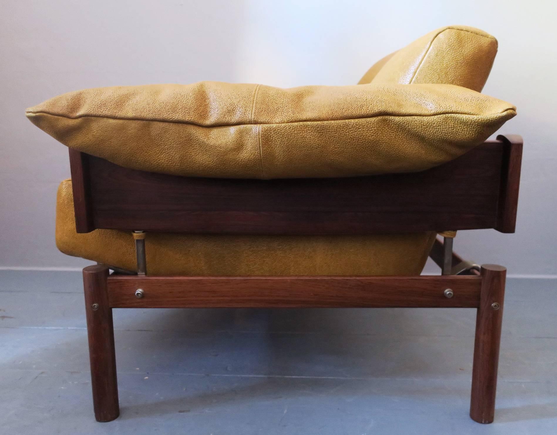 Brazilian lounge chair by Percival Lafer in rosewood, 1960s.

The chair has been recently re-upholstered with well-matched textured leather in muted yellow.